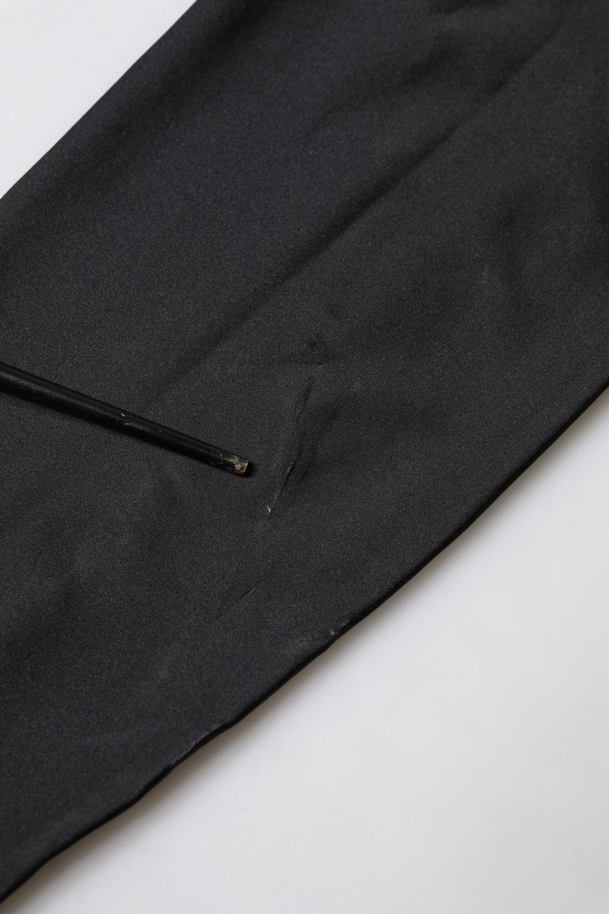 Discover the exquisite Dolce & Gabbana Black Sleeveless Bodycon Jumpsuit Dress, crafted in Italy from premium materials, embodying luxury and timeless elegance for the discerning individual.