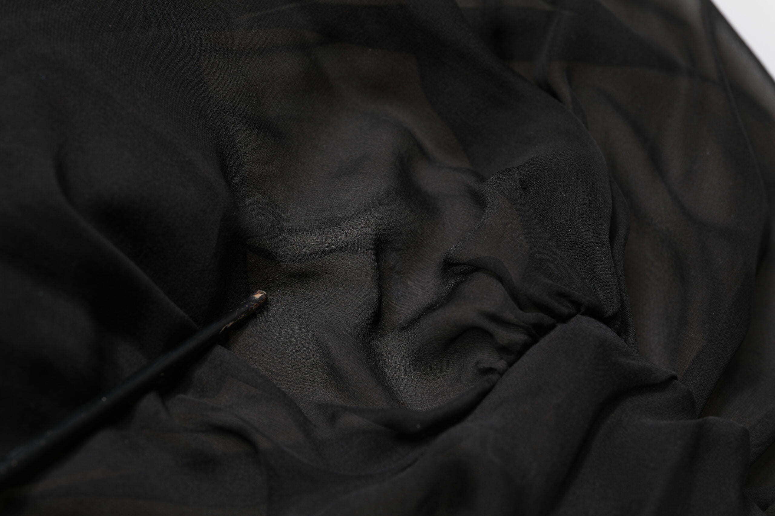 Indulge in the exquisite allure of the Dolce & Gabbana Black Silk Tulle Long Sleeve V-neck Dress, a masterpiece of Italian craftsmanship that embodies luxury and sophistication for unforgettable moments.