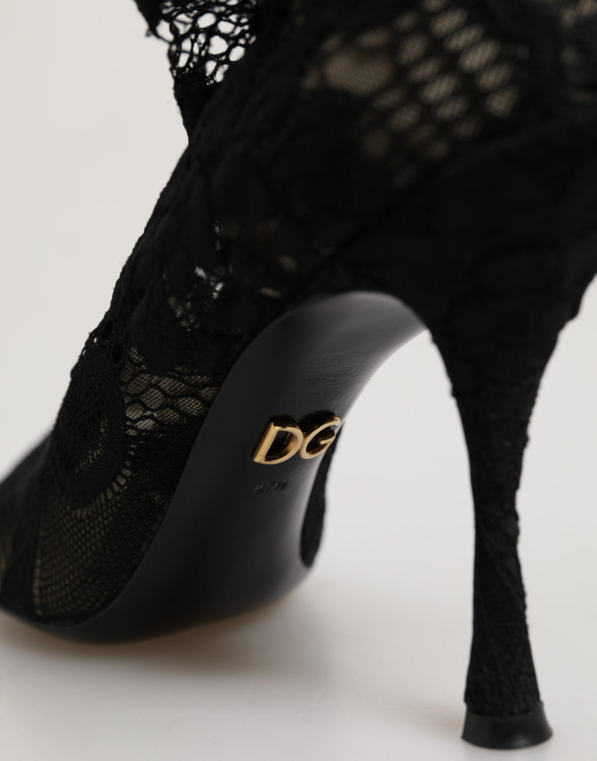 Indulge in the exquisite allure of Dolce & Gabbana's Taormina Lace Sock Boots, where refined craftsmanship meets luxurious materials for timeless elegance.