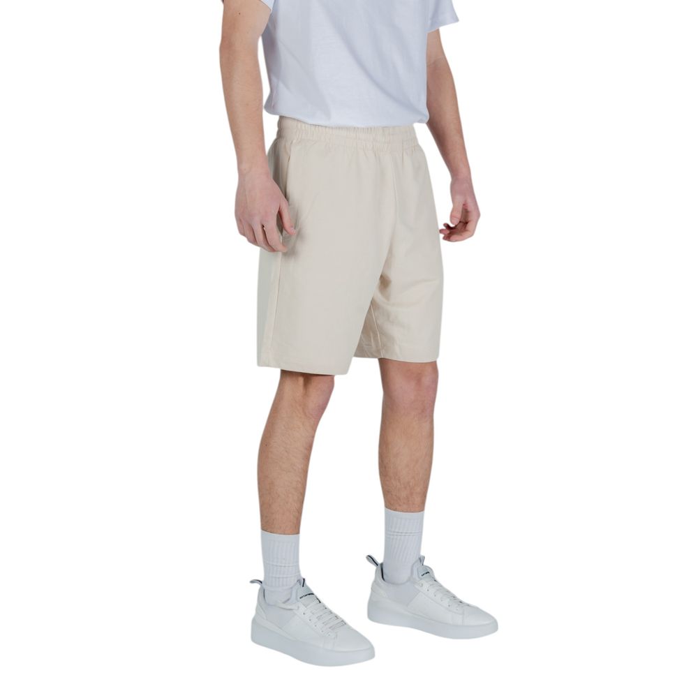 Elevate your summer wardrobe with EA7 Emporio Armani Beige Cotton Bermuda Shorts, crafted for unparalleled comfort and sophisticated leisure, perfect for any refined occasion.