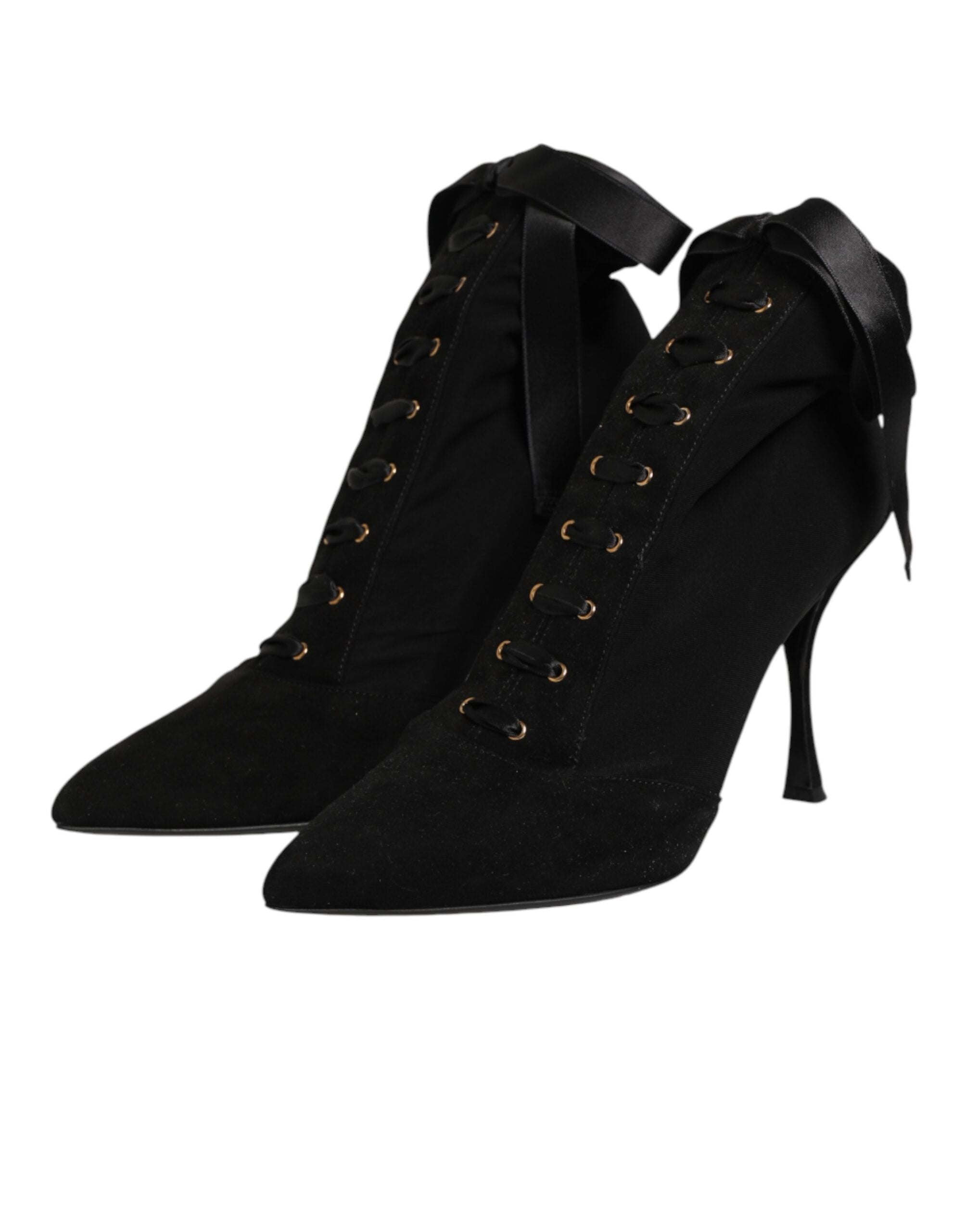 Elevate your style with Dolce & Gabbana's Black Stiletto Heels Lace Up Boots, a masterpiece of exquisite craftsmanship and luxurious materials, perfect for the discerning individual.