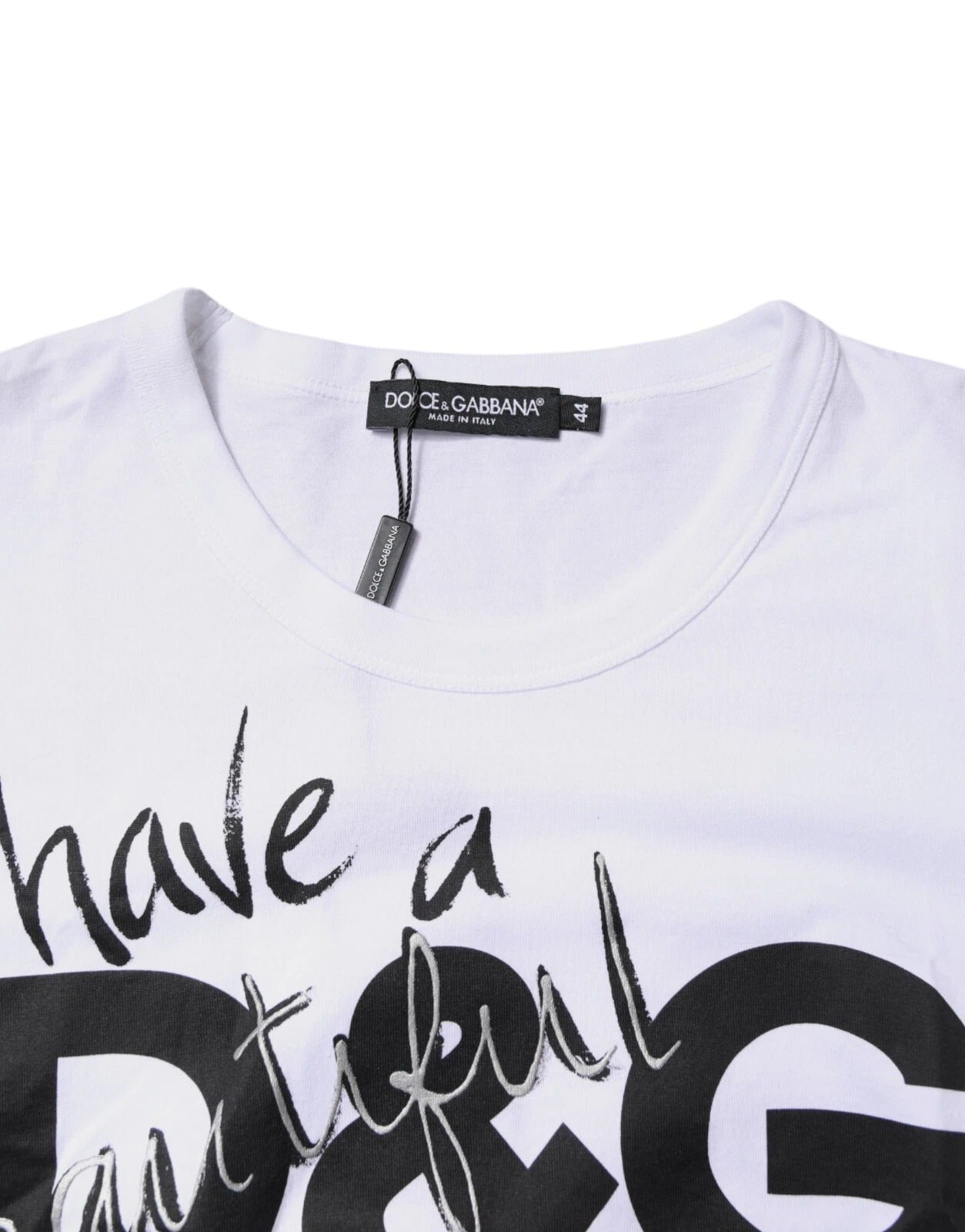 Indulge in the exquisite allure of the Dolce & Gabbana White Graphic Print Cotton Crew Neck T-shirt, a testament to Italian craftsmanship and timeless elegance.