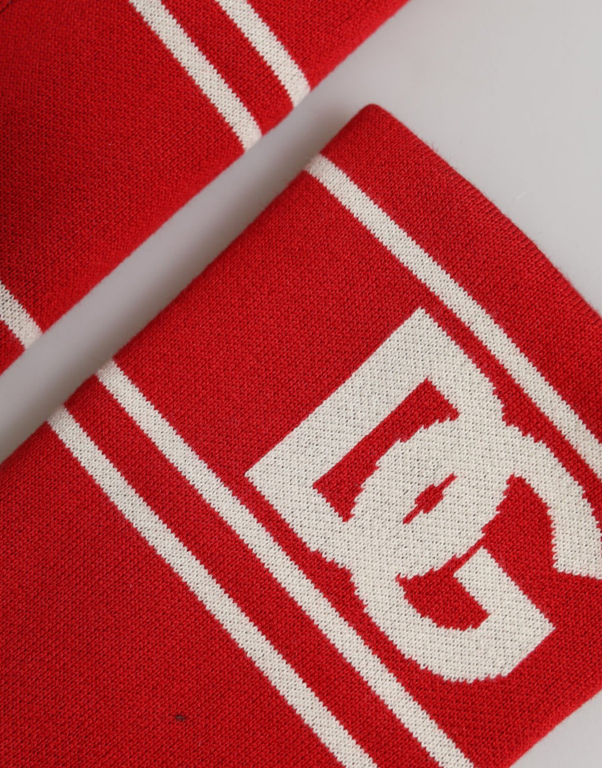 Elevate your accessory collection with the Dolce & Gabbana Red White DG Logo Cotton Wristband, a luxurious statement of Italian craftsmanship and timeless elegance.