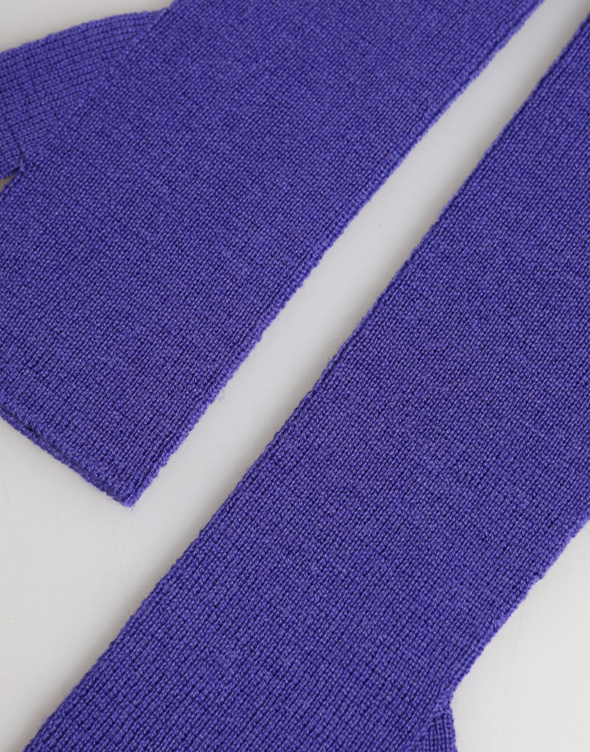 Indulge in the exquisite Dolce & Gabbana Violet Wool Fingerless Elbow Length Mitten Gloves, a timeless accessory that embodies luxury and sophistication, crafted in Italy.