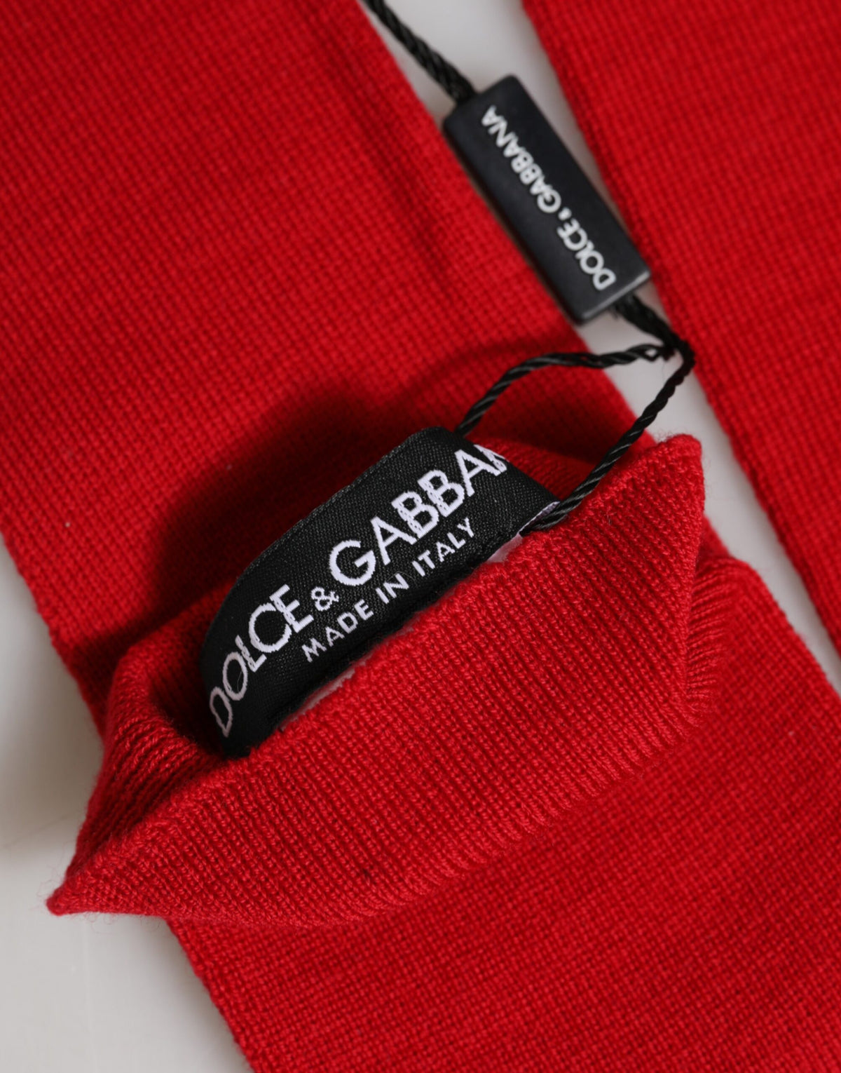 Indulge in the exquisite allure of Dolce & Gabbana Red Wool Knitted Fingerless Elbow Gloves, a luxurious statement of sophistication and timeless Italian craftsmanship.
