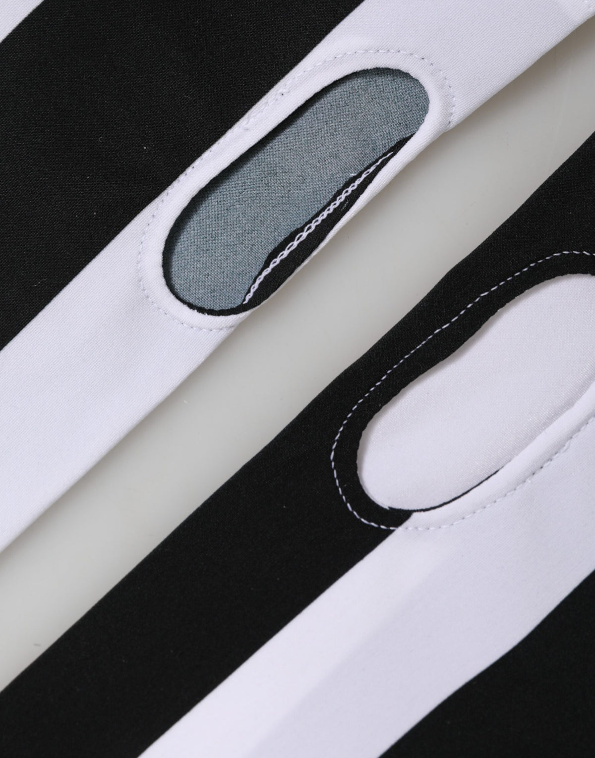 Elevate your style with Dolce & Gabbana's Black White Nylon Fingerless Gloves, a rare blend of luxury and sporty elegance, crafted in Italy for the discerning individual.