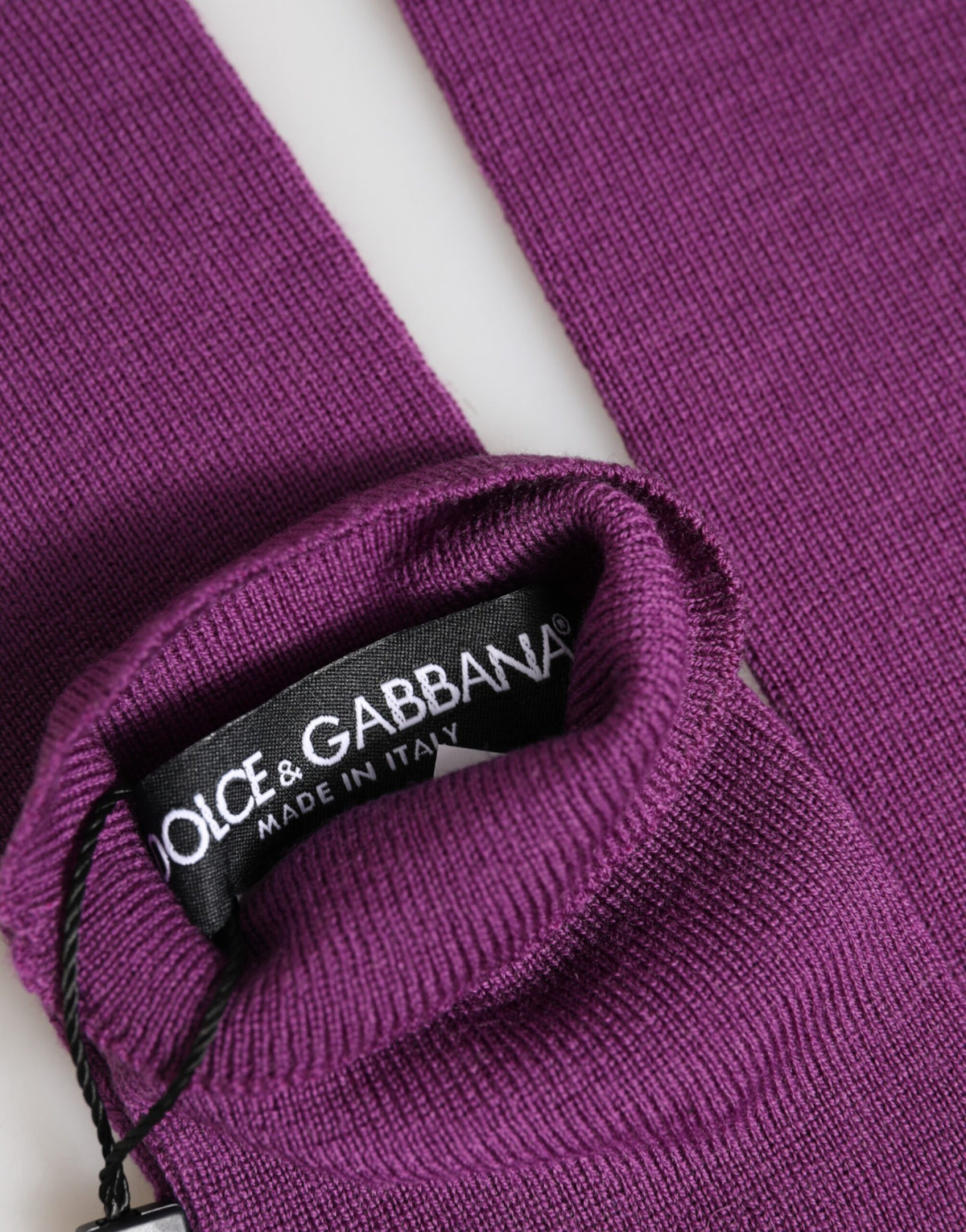 Indulge in the exquisite Dolce & Gabbana Purple Wool Fingerless Elbow Length Gloves, a luxurious blend of Italian craftsmanship and modern elegance, perfect for any sophisticated occasion.