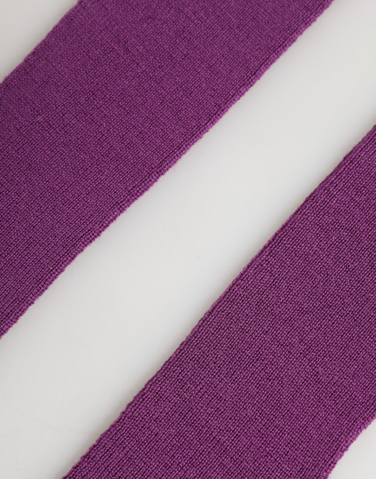 Indulge in the luxurious Dolce & Gabbana Purple Wool Fingerless Elbow Length Gloves, crafted from soft wool to elevate your style with Italian elegance and timeless sophistication.
