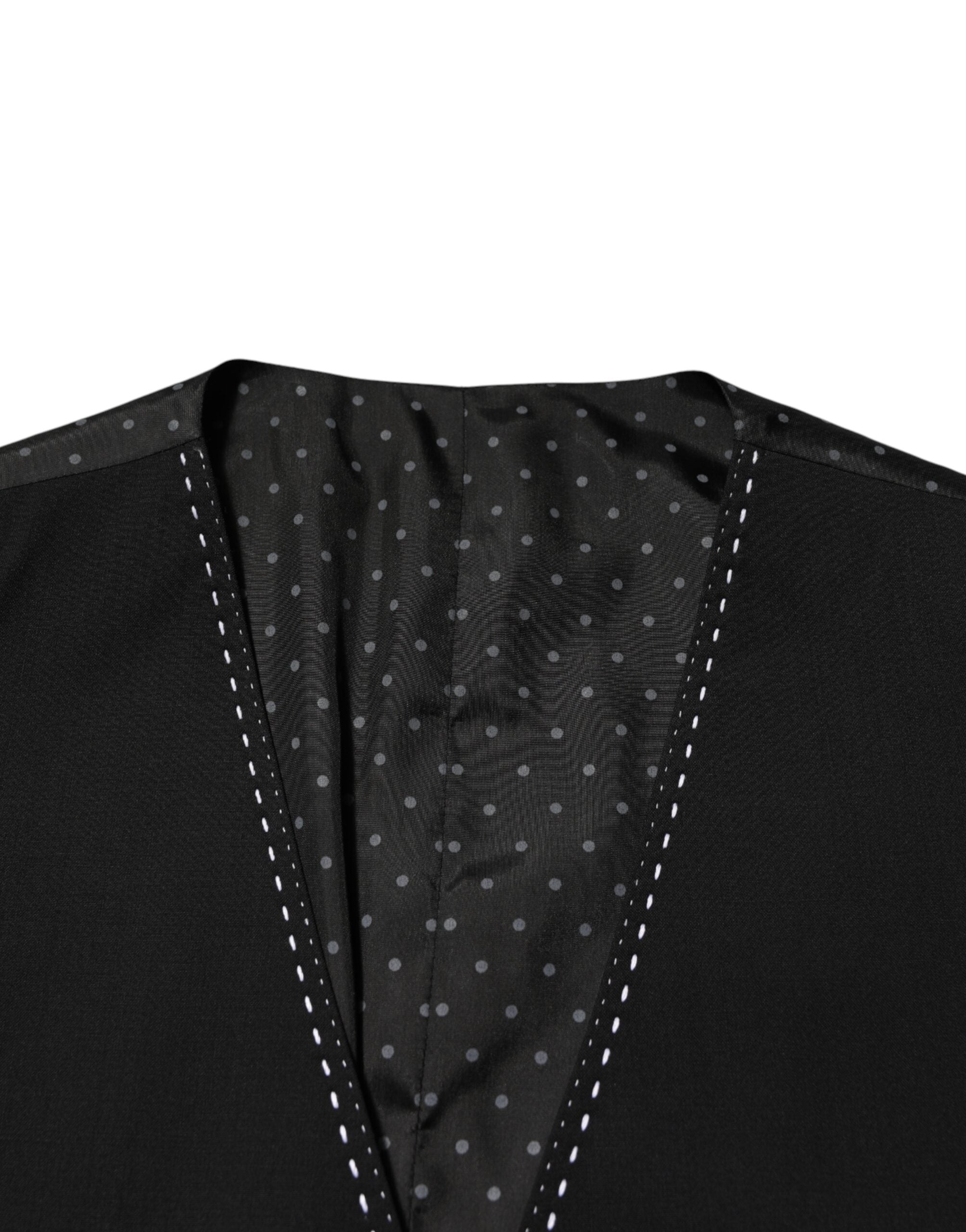 Elevate your formal wardrobe with the Dolce & Gabbana Black Wool Dress Waistcoat Vest, a masterpiece of Italian craftsmanship that embodies timeless elegance and sophistication.