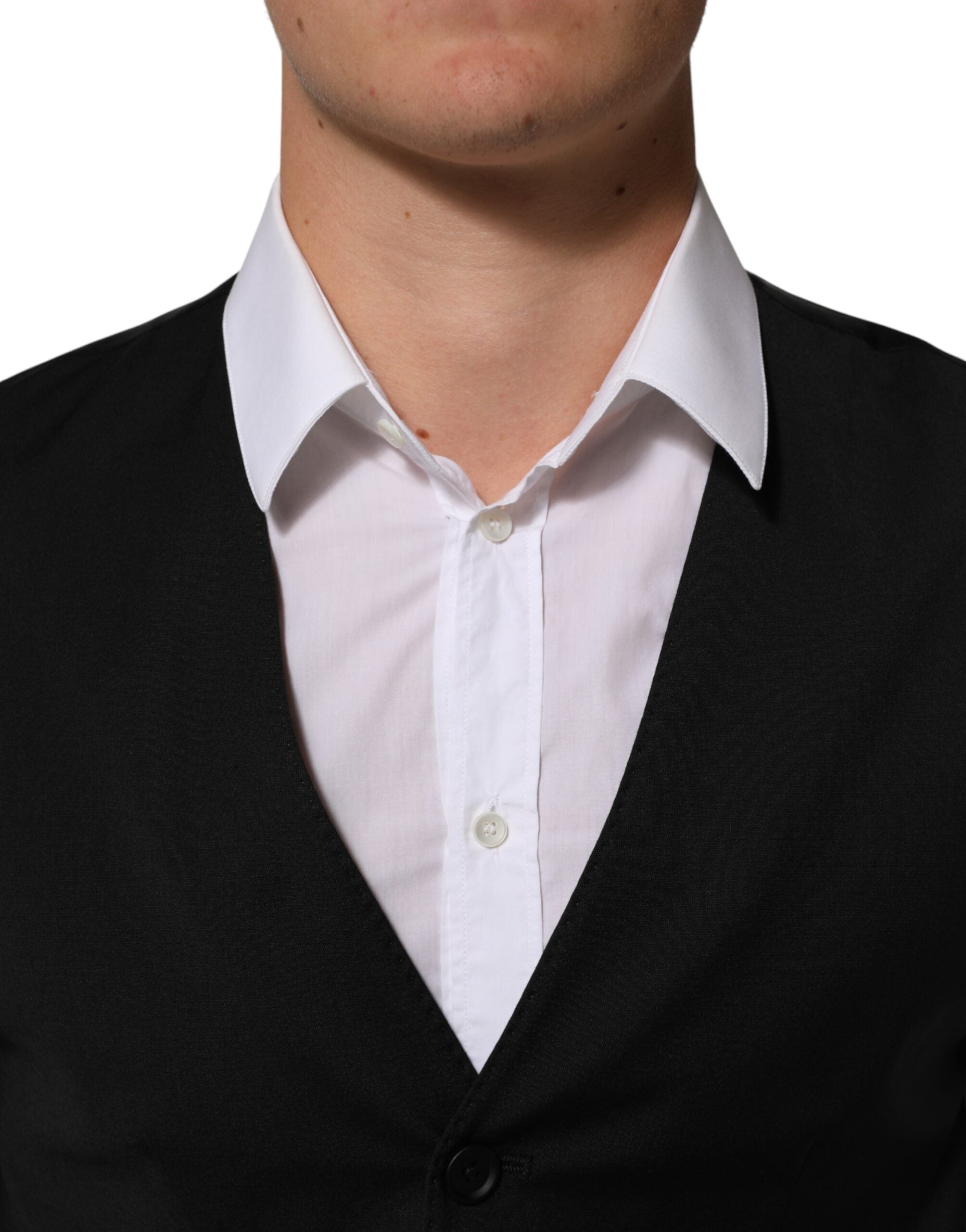 Elevate your elegance with the Dolce & Gabbana Black Polyester Dress Formal Waistcoat Vest, a masterpiece of Italian craftsmanship that embodies timeless sophistication and allure.
