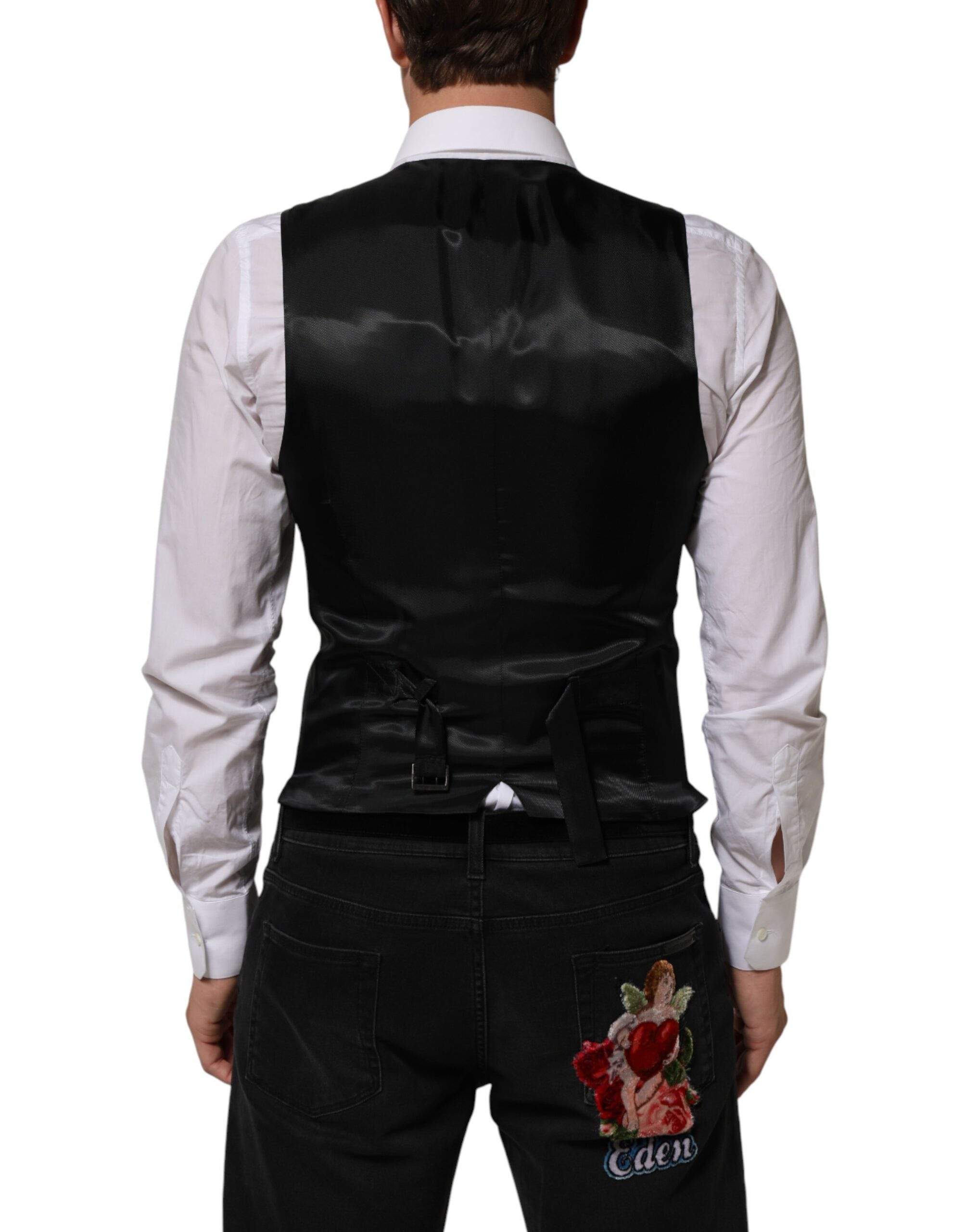 Elevate your wardrobe with the Dolce & Gabbana Black Wool Men Dress Formal Waistcoat Vest, a masterpiece of Italian craftsmanship designed for the discerning individual.