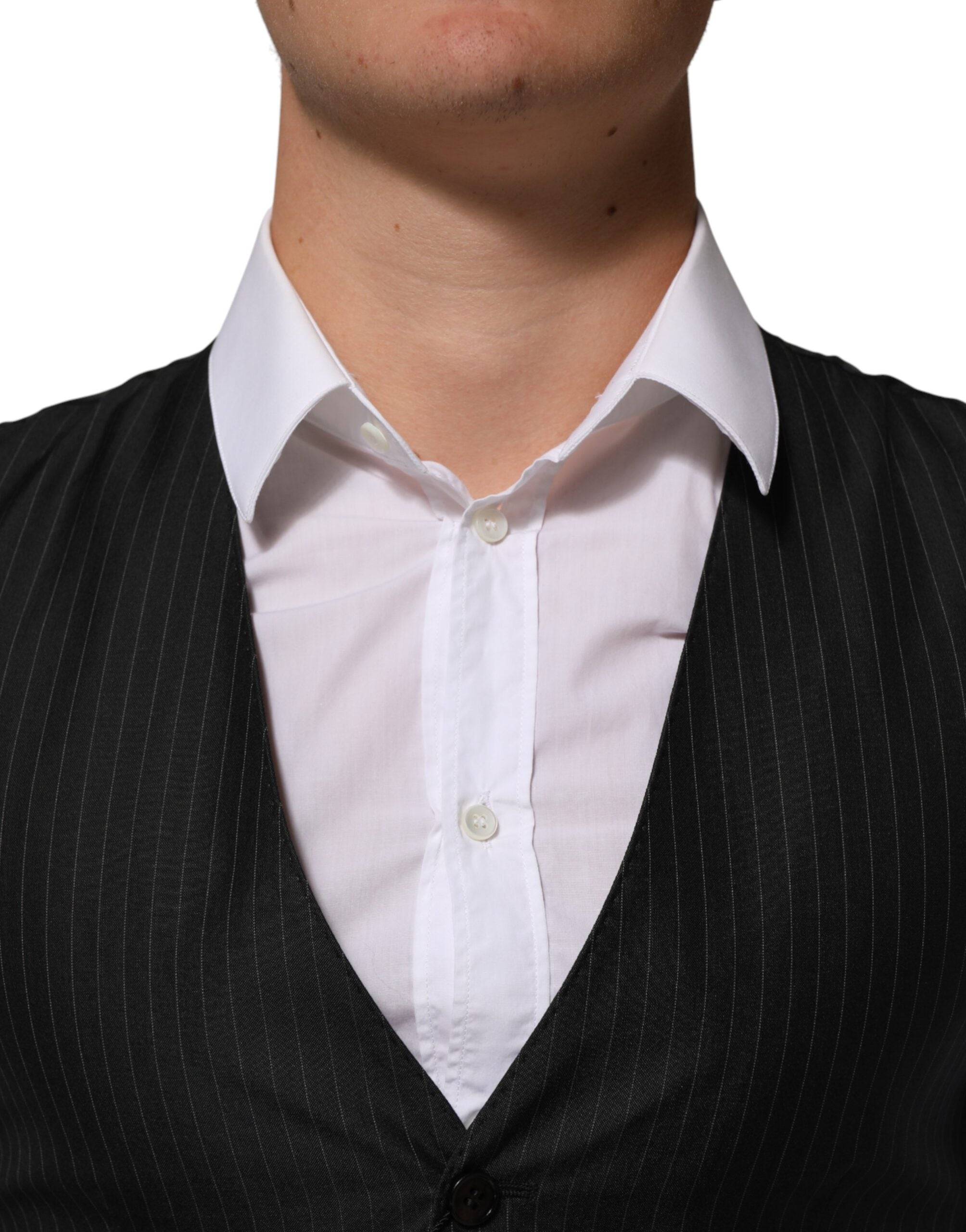 Elevate your style with the Dolce & Gabbana Black Wool Men Dress Formal Waistcoat Vest, a masterpiece of artisanal elegance crafted from a luxurious wool blend.