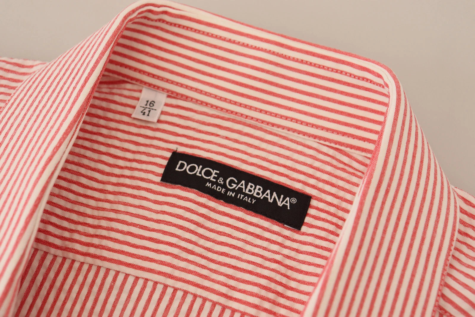 Indulge in the exquisite Dolce & Gabbana Red White Striped Cotton Short Sleeve Shirt, a timeless blend of elegance and versatility crafted for the discerning individual.