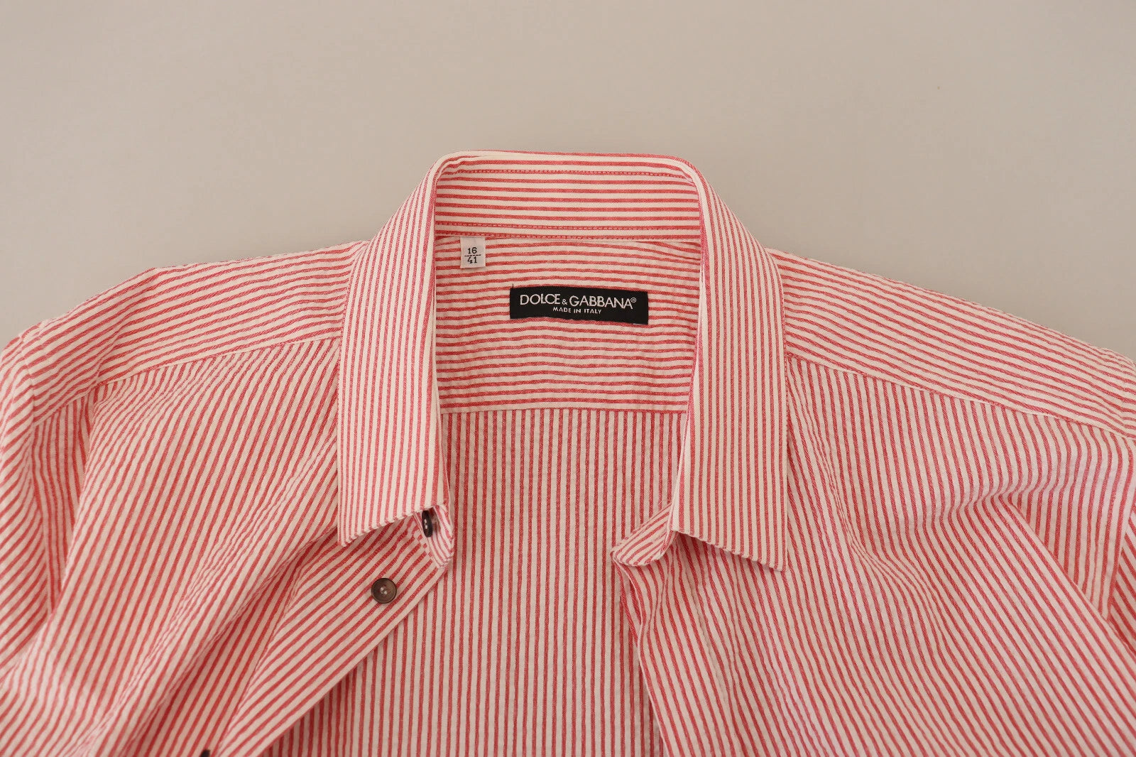 Discover the exquisite Dolce & Gabbana Red White Striped Cotton Short Sleeve Shirt, a timeless blend of elegance and versatility, crafted for the discerning individual.