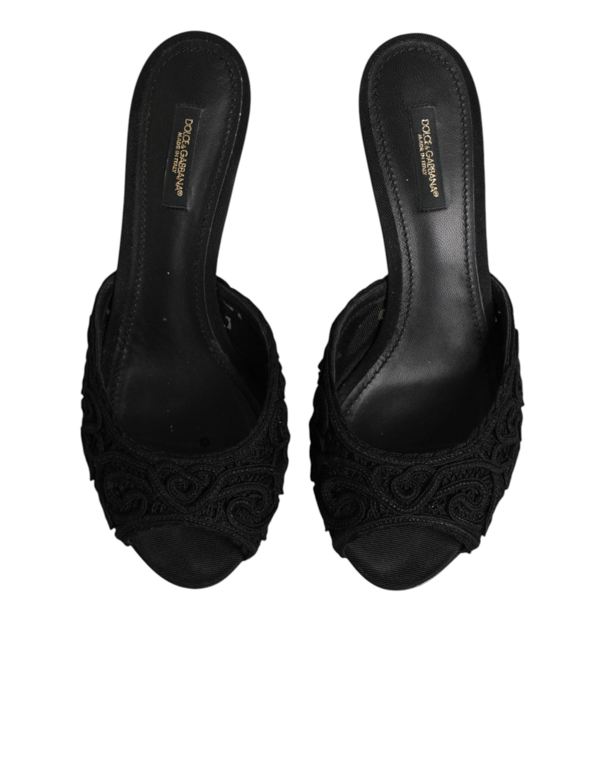 Experience the allure of Dolce & Gabbana's Black Embroidered Slip On Heels, crafted in Italy with exquisite materials, embodying luxury and sophistication for every occasion.