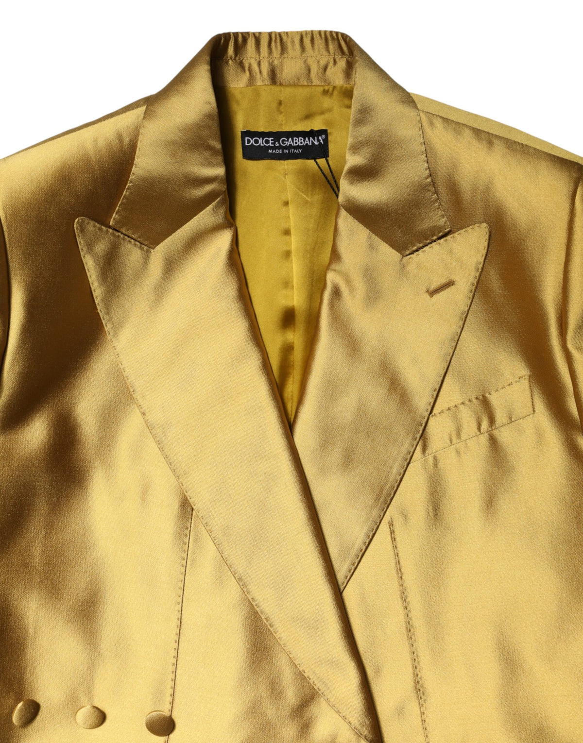 Elevate your elegance with the Dolce & Gabbana Gold Satin Blazer, a masterpiece of silk craftsmanship that embodies luxury and sophistication for every occasion.