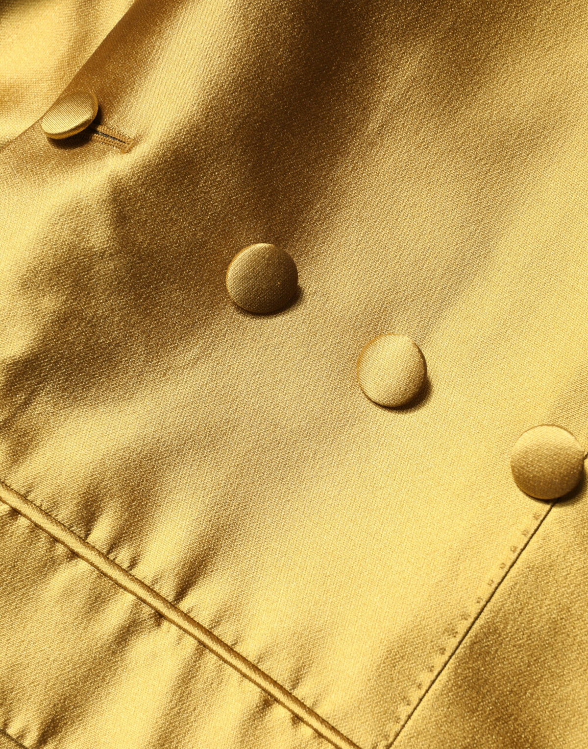 Experience the allure of the Dolce & Gabbana Gold Satin Blazer, a masterpiece of silk craftsmanship that elevates your elegance for any occasion.