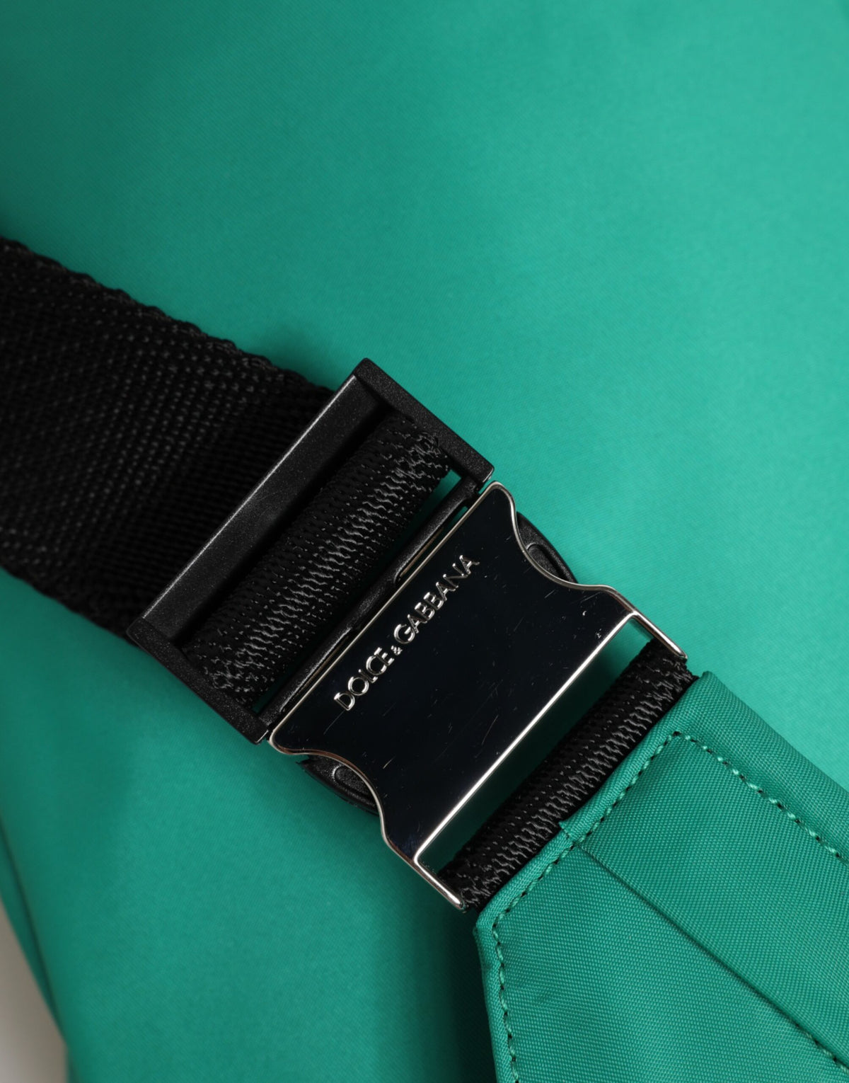 Elevate your style with the Dolce & Gabbana Green Logo Plaque Nylon Fanny Pack, a luxurious blend of nylon and calfskin, embodying sophistication and timeless elegance.