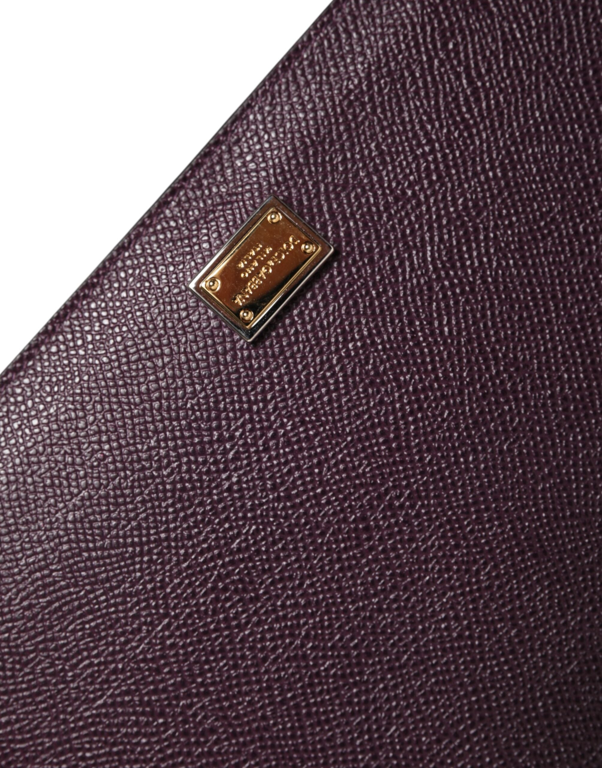 Indulge in the exquisite Dolce & Gabbana Dark Brown Leather Logo Plaque Cover Sleeve Tablet Case, a fusion of luxurious materials and Italian craftsmanship, perfect for the discerning individual.