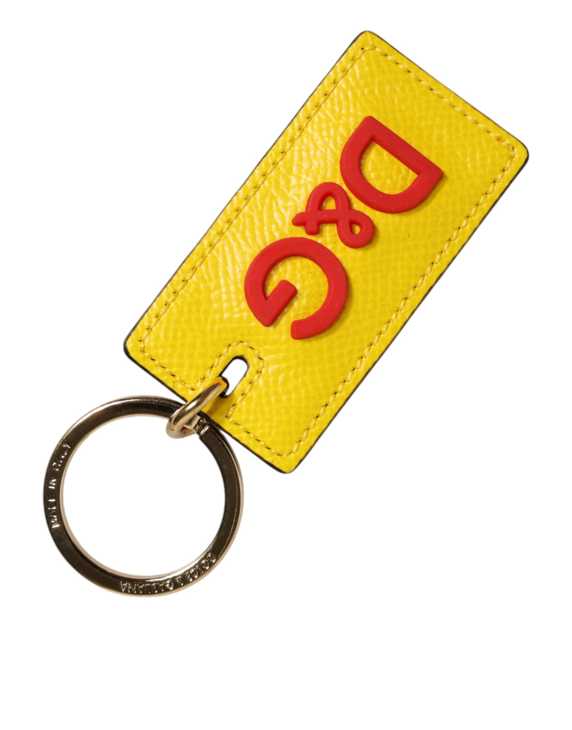 Elevate your style with the Dolce & Gabbana Yellow Calf Leather Keychain, a luxurious emblem of refined craftsmanship and timeless elegance, perfect for discerning tastes.