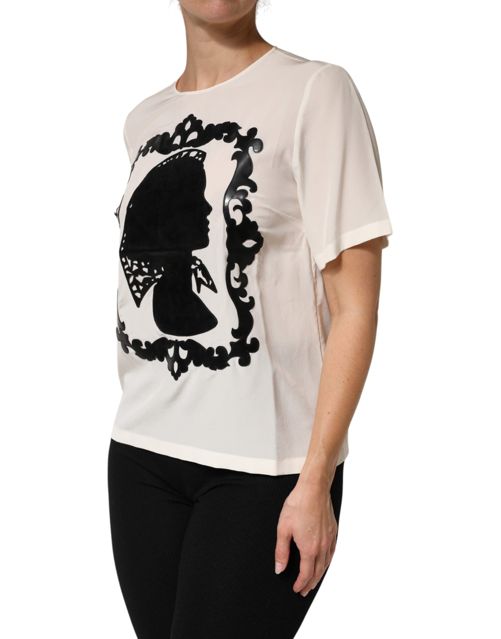 Indulge in the exquisite Dolce & Gabbana Cream Silk Silhouette Detail Top, a luxurious blend of Italian craftsmanship and timeless elegance, perfect for any sophisticated wardrobe.