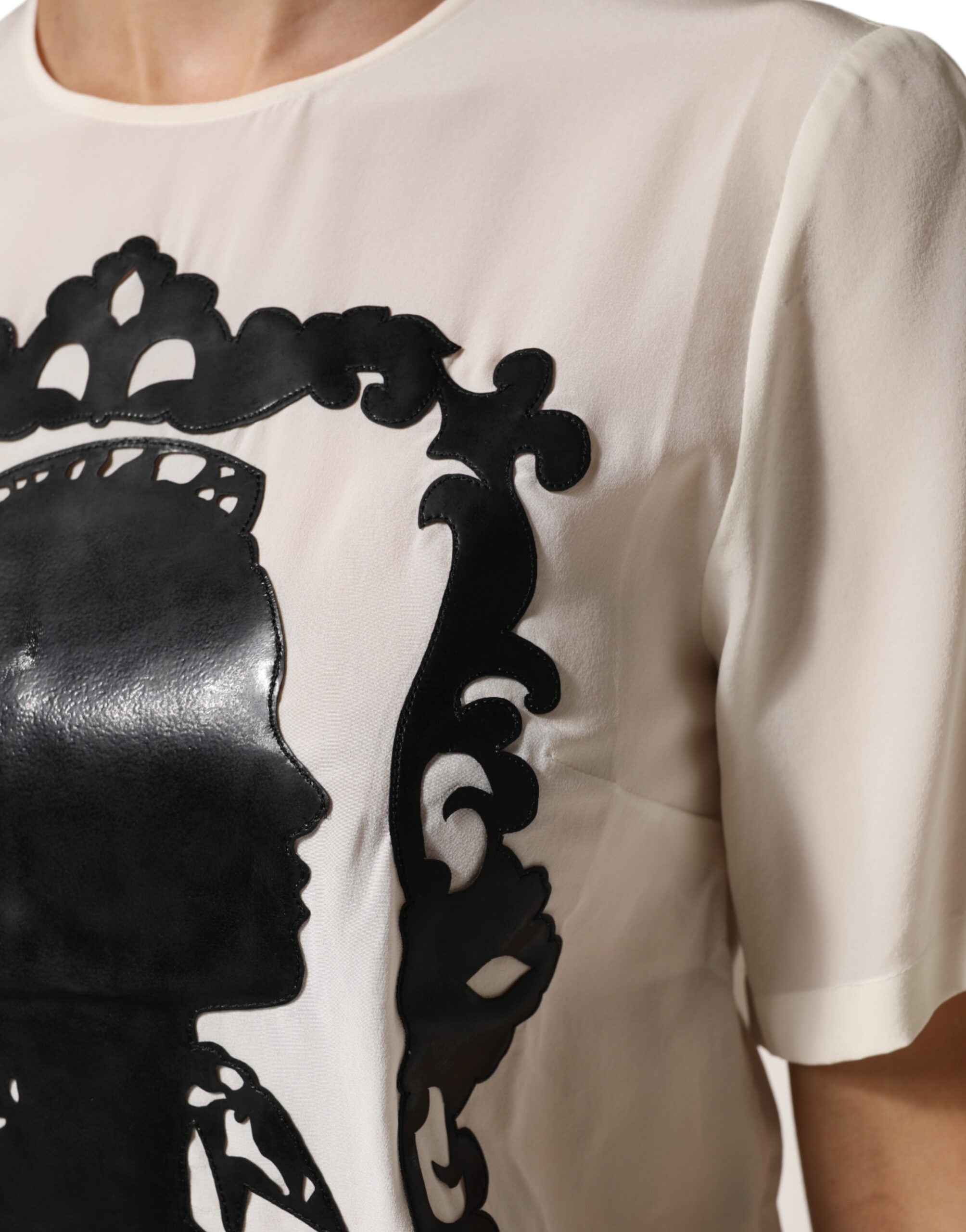 Indulge in the exquisite Dolce & Gabbana Cream Silk Silhouette Detail Short Sleeve Top, a luxurious blend of Italian craftsmanship and timeless elegance for every discerning wardrobe.