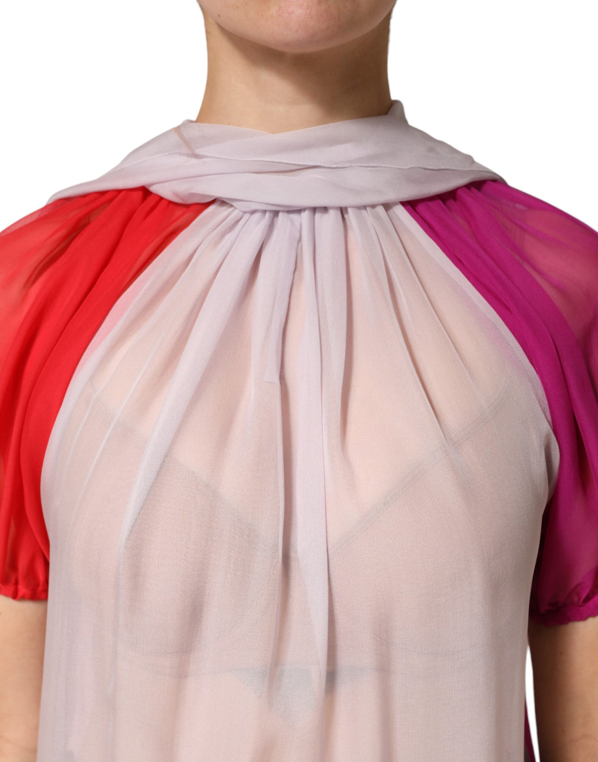 Elevate your wardrobe with the Dolce & Gabbana Multicolor Short Sleeves Silk Blouse, a luxurious silk masterpiece that embodies Italian craftsmanship and timeless elegance.