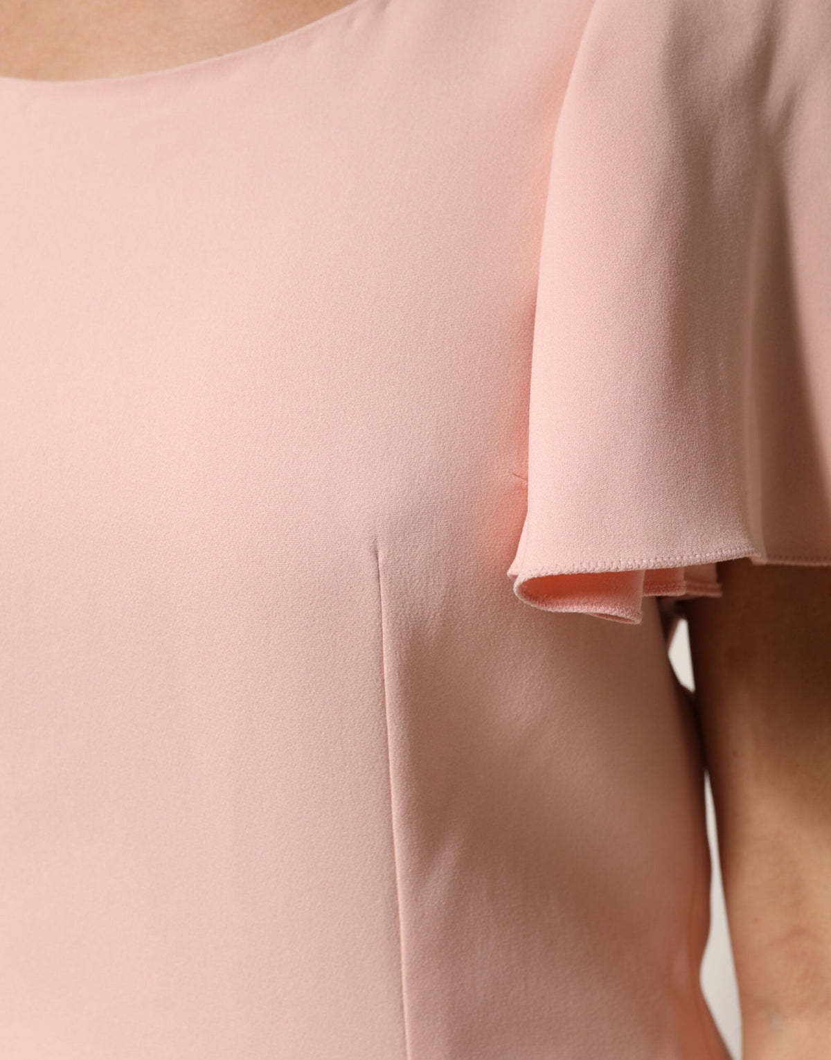 Indulge in the exquisite allure of the Dolce & Gabbana Pink Short Sleeves Round Neck Blouse, crafted from luxurious materials for timeless elegance and refined sophistication.