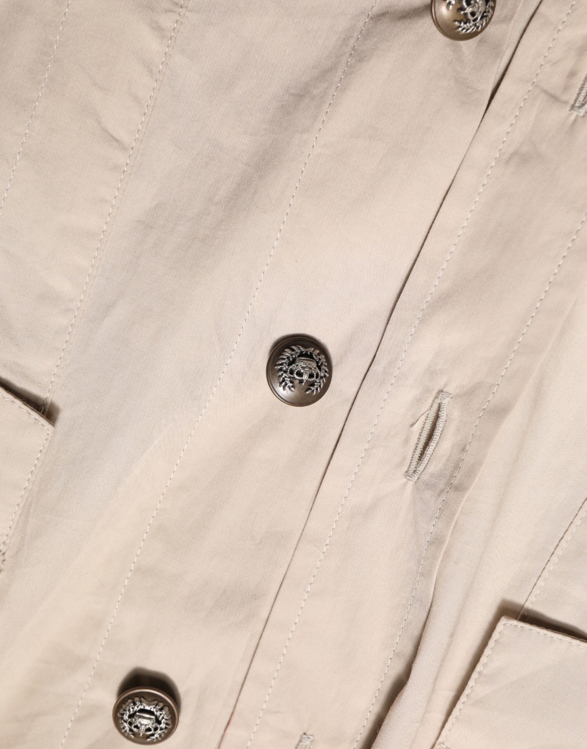 Discover the Dolce & Gabbana beige collared long sleeve cotton shirt top, a timeless blend of Italian craftsmanship and modern elegance, perfect for any sophisticated occasion.