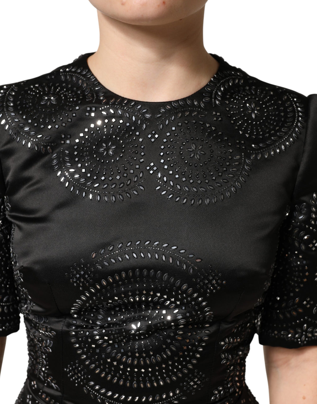 Indulge in the exquisite allure of the Dolce & Gabbana Black Embellished Short Sleeve Sheath Dress, a timeless masterpiece crafted in luxurious silk, embodying elegance and sophistication for every occasion.