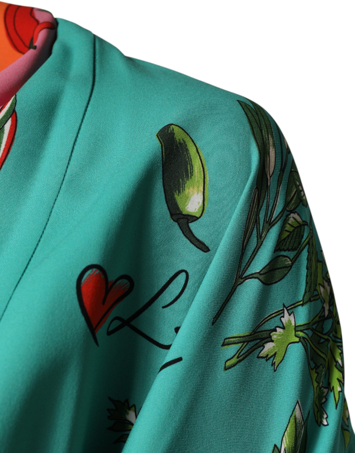 Indulge in the exquisite Dolce & Gabbana Green Printed Long Sleeve Wrap Coat Dress, a luxurious silk masterpiece that embodies elegance and timeless allure, perfect for any sophisticated occasion.