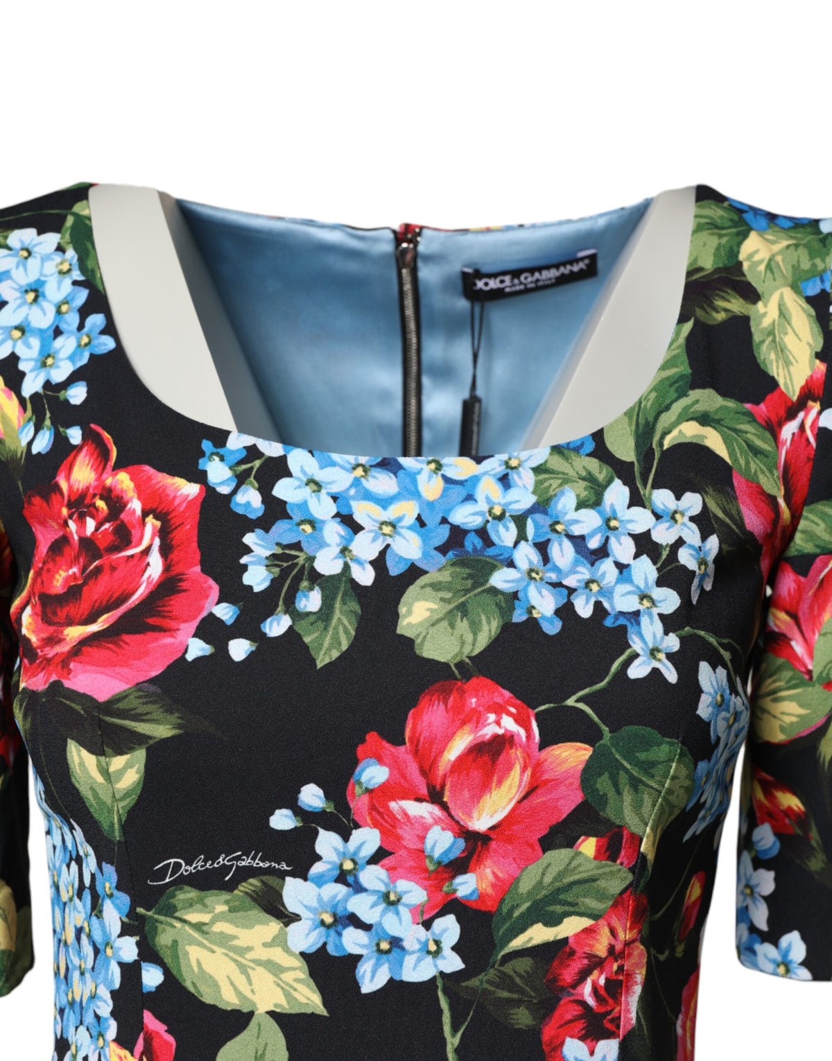 Discover the Dolce & Gabbana Black Floral Print Viscose Sheath Midi Dress, a masterpiece of Italian craftsmanship that embodies timeless elegance and sensual allure.