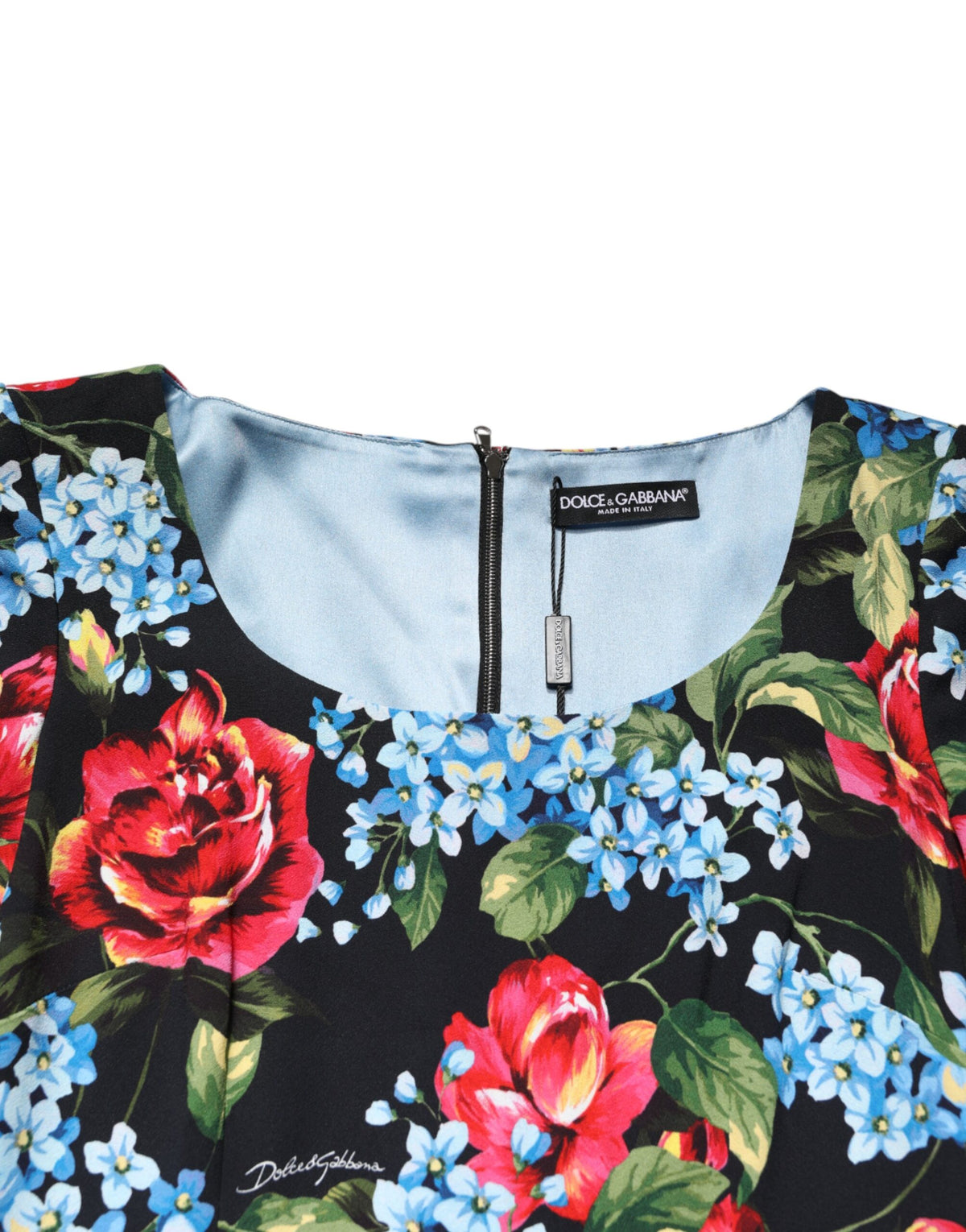 Discover the exquisite Dolce & Gabbana Black Floral Print Viscose Sheath Midi Dress, a timeless blend of luxurious craftsmanship and elegant design, perfect for any refined wardrobe.