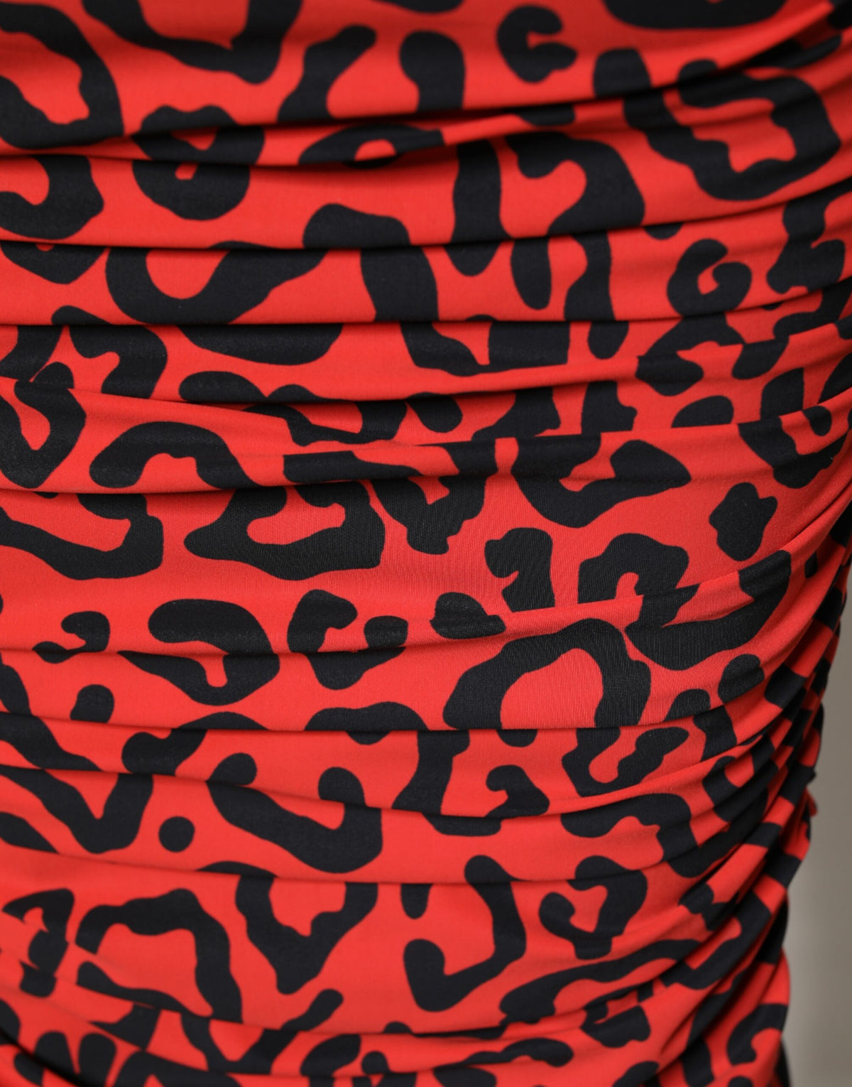 Elevate your wardrobe with the Dolce & Gabbana Red Leopard Print Sheath Midi Dress, a luxurious Italian creation that embodies exquisite craftsmanship and bold sophistication.