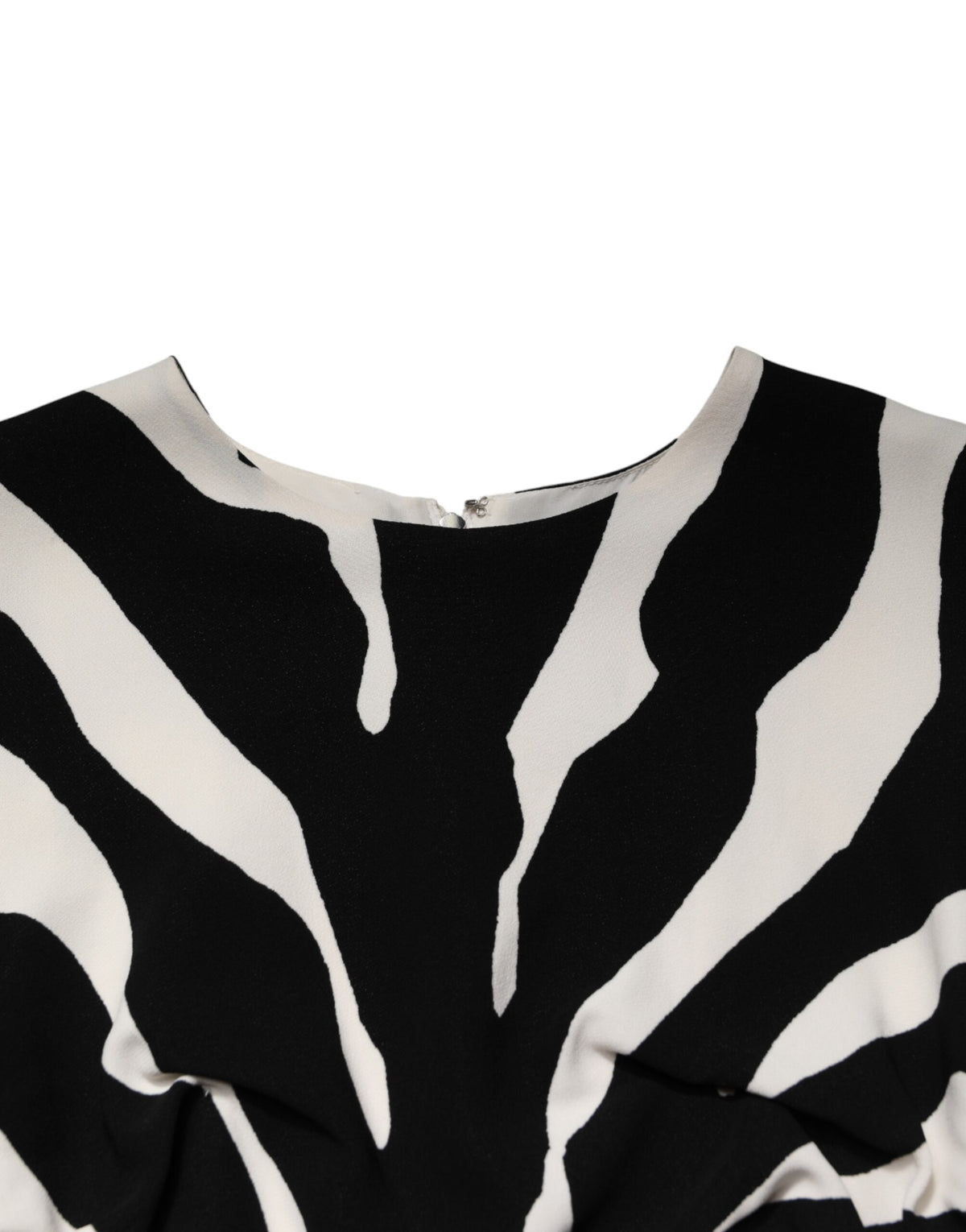 Indulge in the exquisite Dolce & Gabbana Black White Zebra Viscose Sheath Midi Dress, a masterpiece of Italian craftsmanship that embodies timeless elegance and sophisticated allure.