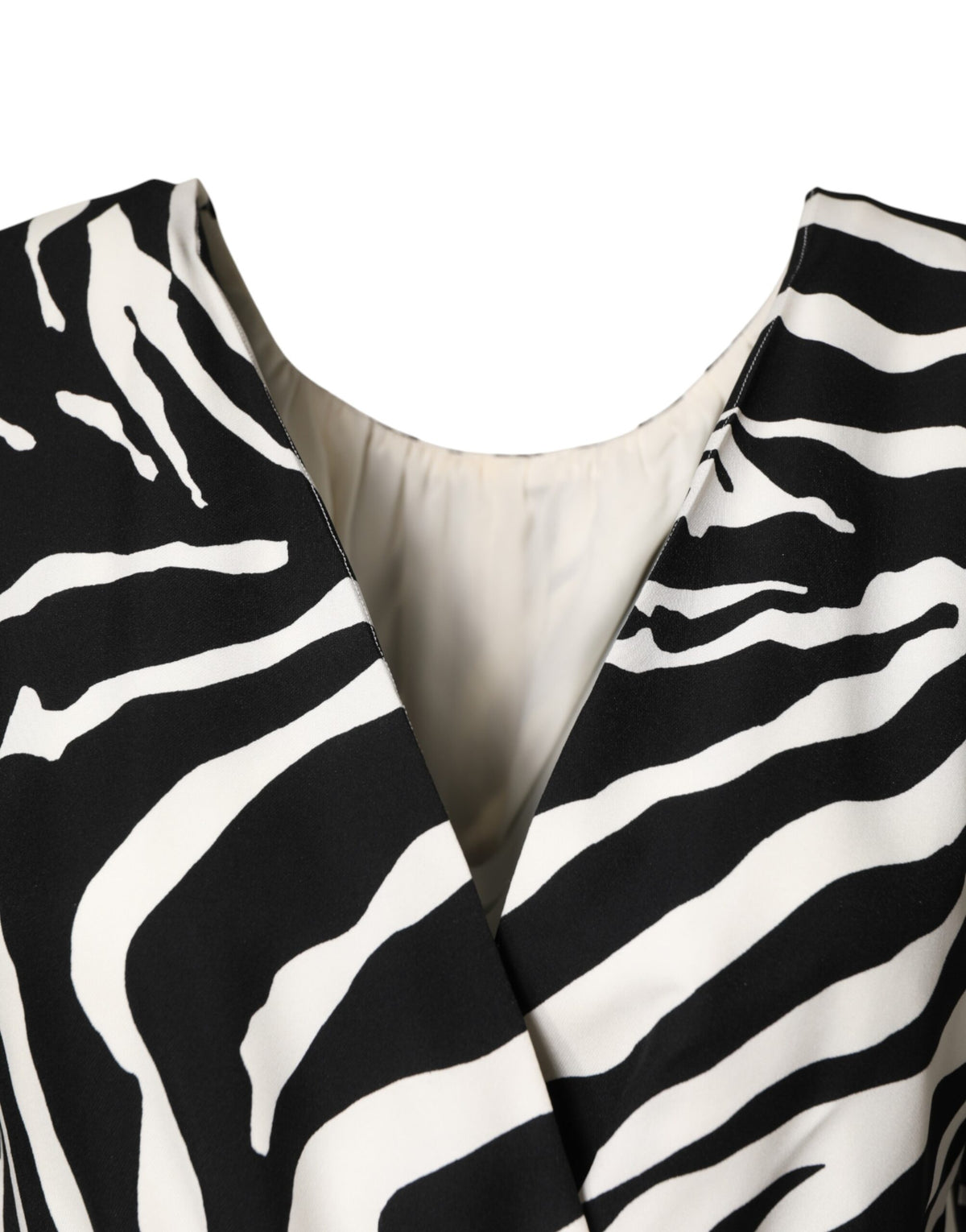 Indulge in the exquisite Dolce & Gabbana Black White Zebra Silk Sheath Mini Dress, a timeless statement of luxury and elegance, crafted in Italy for the discerning individual.