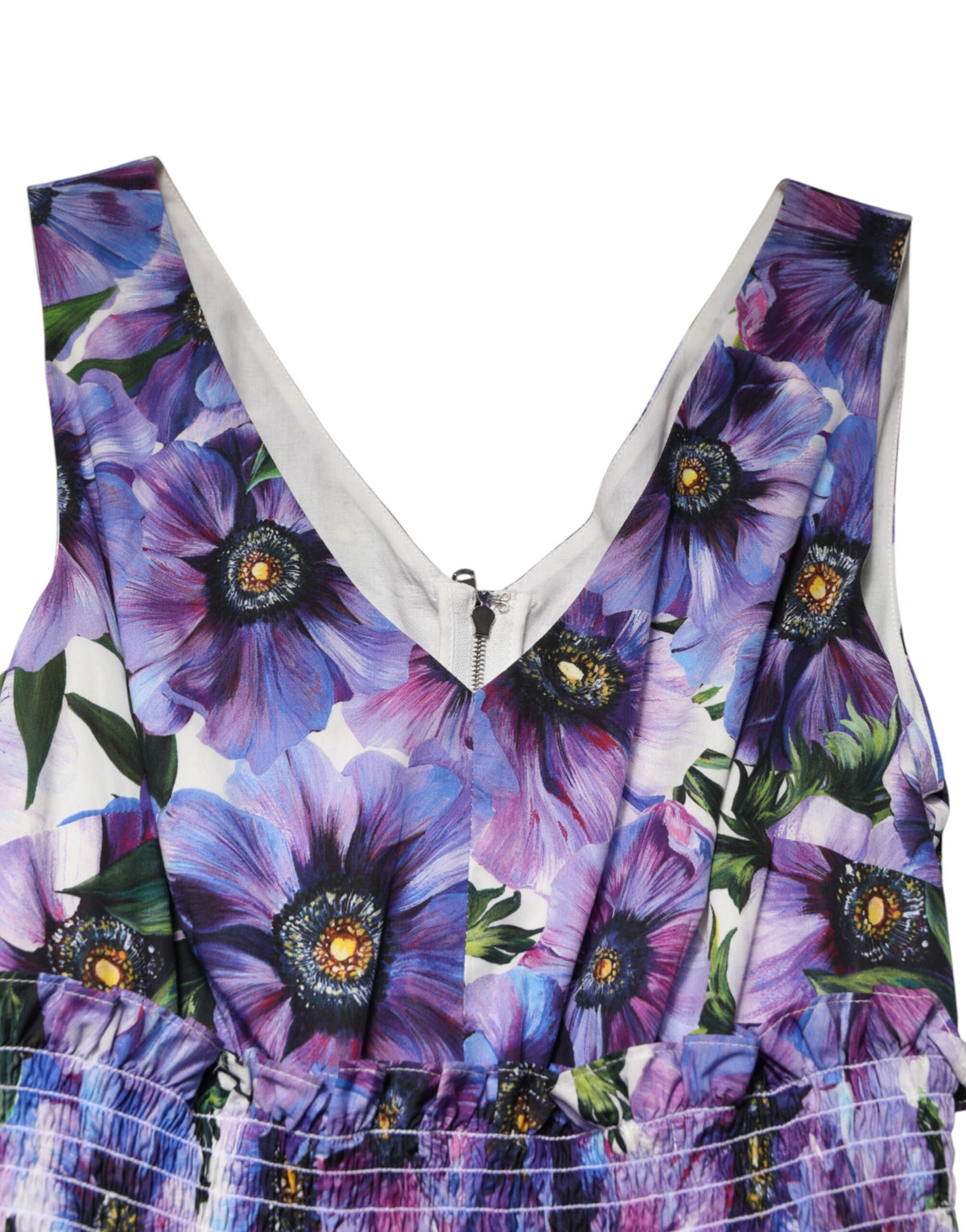 Discover the Dolce & Gabbana Purple Anemone Print Pleated Midi Dress, a masterpiece of exquisite craftsmanship in 100% cotton, embodying timeless elegance and allure.