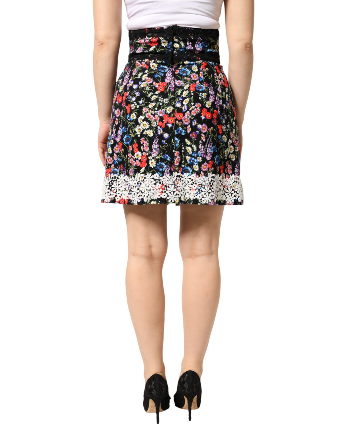 Indulge in the exquisite Dolce & Gabbana Black Floral Lace Cotton High-Waist Mini Skirt, a timeless masterpiece of Italian craftsmanship that elevates elegance and allure.