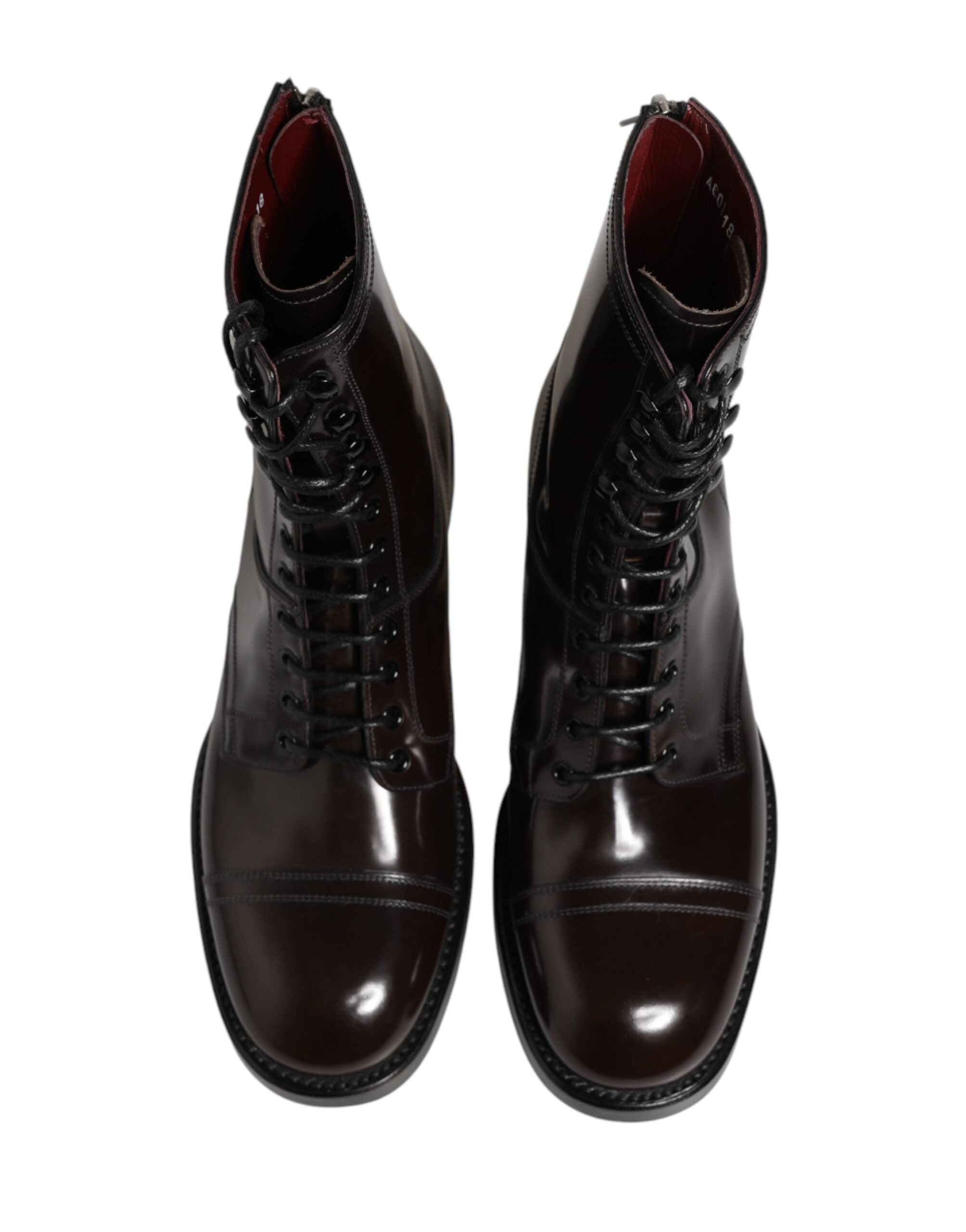 Discover the exquisite Dolce & Gabbana Black Leather Lace Up Mid Calf Boots, a timeless blend of artisanal craftsmanship and luxurious elegance, perfect for the discerning individual.