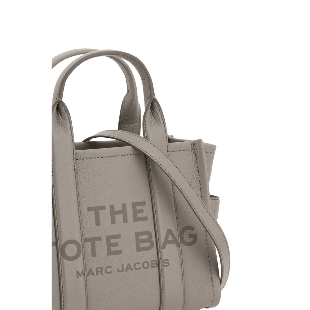 Elevate your elegance with the Marc Jacobs Gray Calf Leather Bos Taurus Handbag, a timeless masterpiece of luxury and sophistication crafted for the discerning individual.