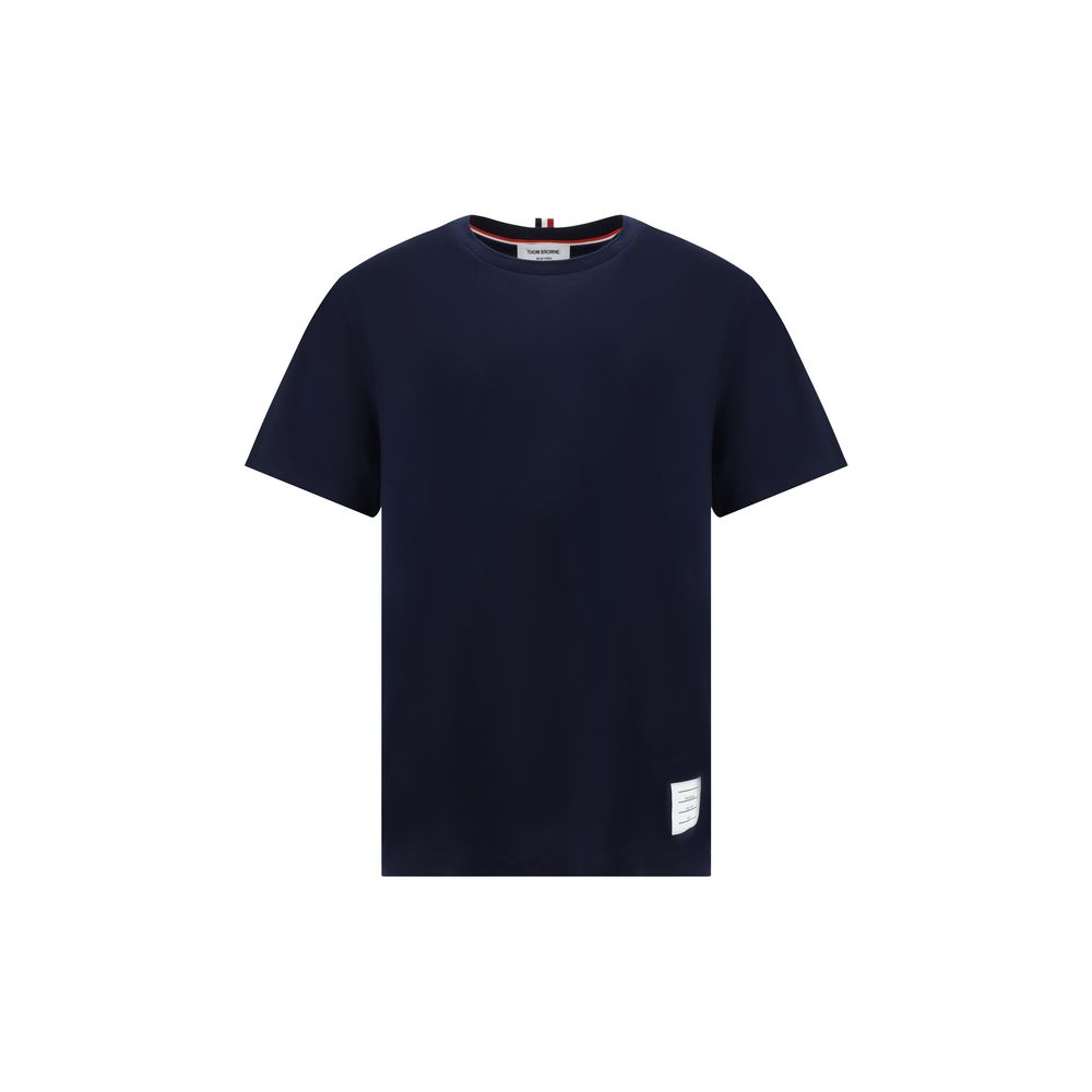 Experience the epitome of elegance with the Thom Browne Blue Cotton T-Shirt, crafted from luxurious 100% cotton, designed for the discerning individual who values sophistication and style.