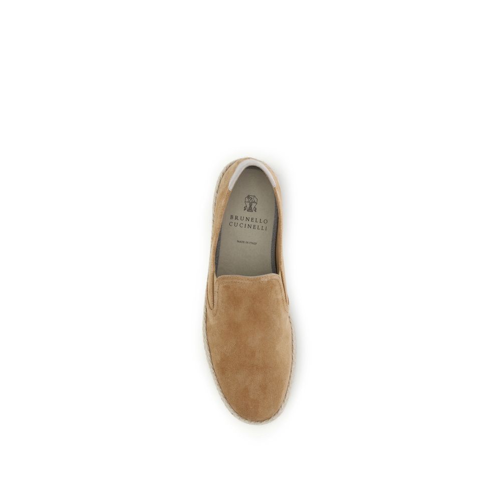 Indulge in the exquisite craftsmanship of Brunello Cucinelli's Beige Calf Leather Bos Taurus Espadrilles, where luxurious materials meet timeless elegance for every sophisticated occasion.