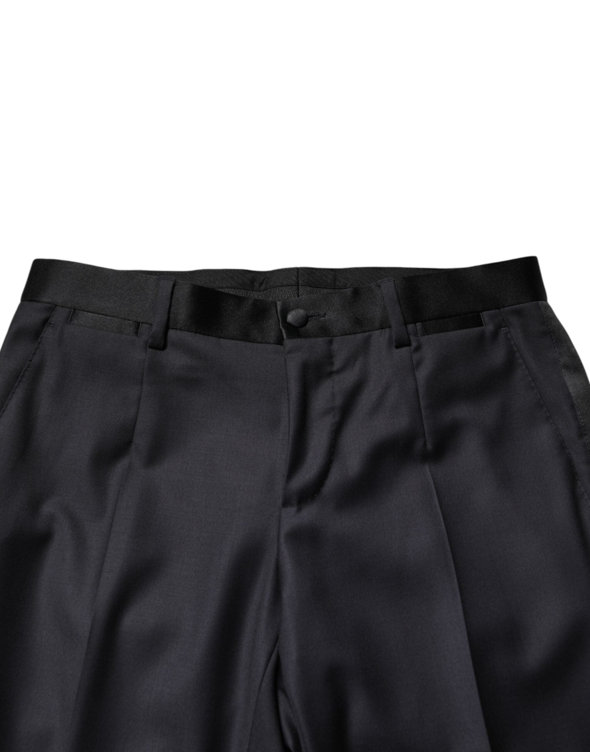 Elevate your elegance with Dolce & Gabbana's Black Wool Single Breasted 3 Piece Suit, a masterpiece of Italian craftsmanship, luxurious materials, and timeless sophistication.