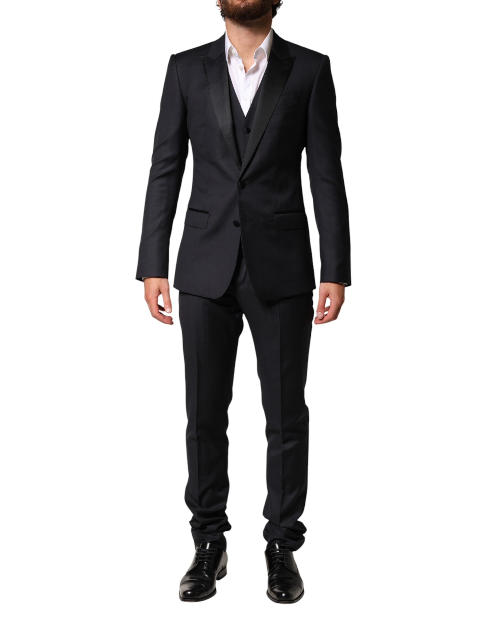 Elevate your elegance with the Dolce & Gabbana Black Wool Single Breasted 3 Piece Suit, a masterpiece of Italian craftsmanship that embodies timeless sophistication and luxurious allure.