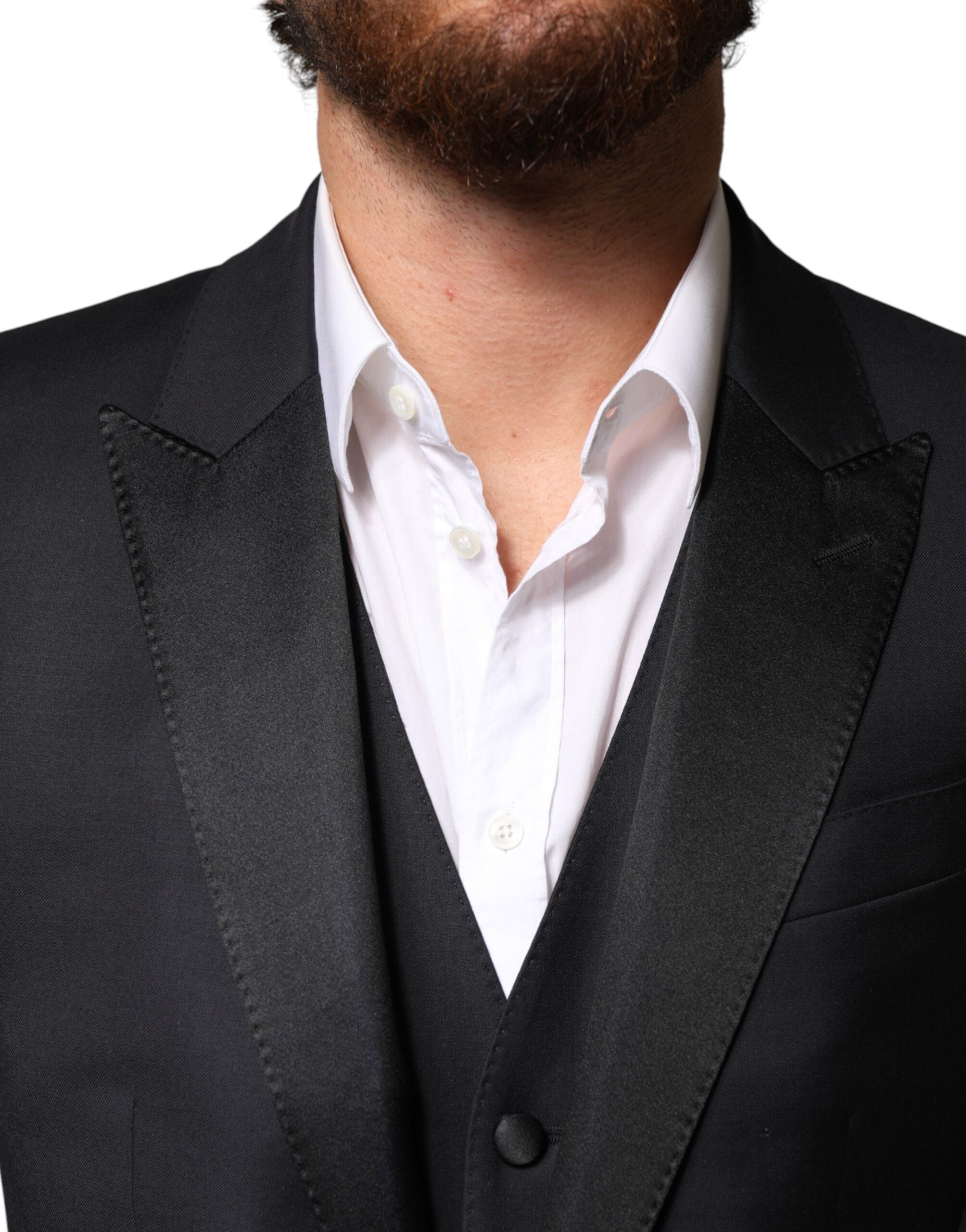 Indulge in the exquisite Dolce & Gabbana Black Wool Single Breasted 3 Piece Suit, a masterclass in Italian craftsmanship, designed for the discerning individual who embodies elegance and sophistication.