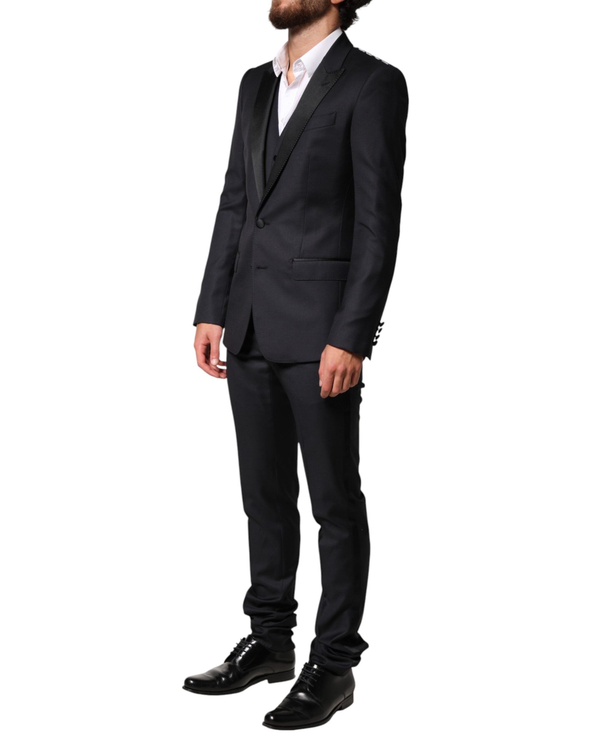 Experience the epitome of Italian elegance with Dolce & Gabbana's Black Wool Single Breasted 3 Piece Suit, crafted from luxurious wool, silk, and polyester for timeless sophistication.