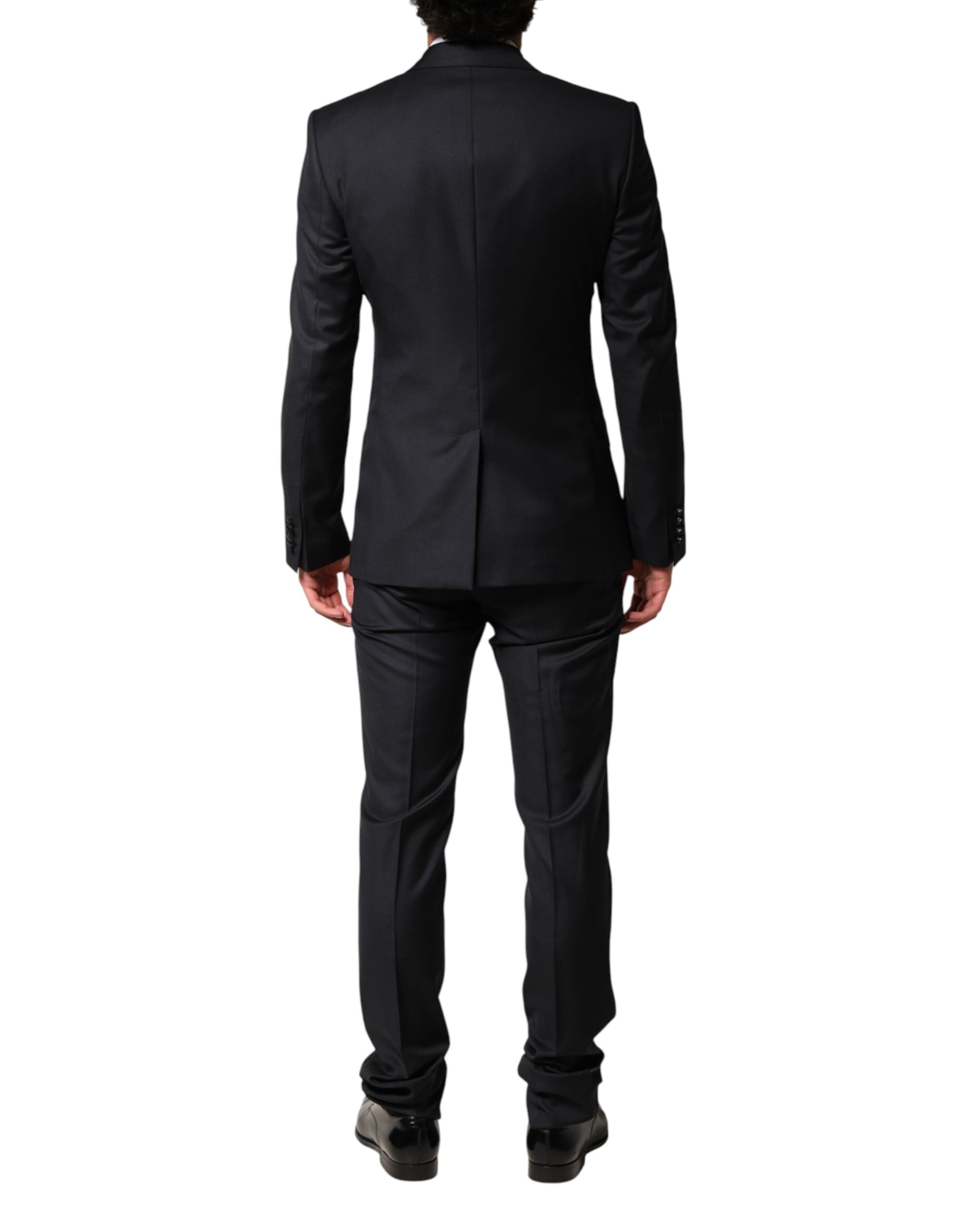 Discover the epitome of sophistication with Dolce & Gabbana's Black Wool Single Breasted 3 Piece Suit, crafted from luxurious wool and silk for the discerning individual.
