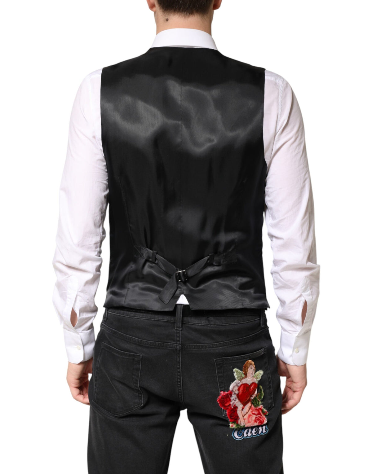 Elevate your style with the Dolce & Gabbana Black Stripes Wool Dress Waistcoat Vest, a timeless piece crafted from 100% virgin wool, embodying unparalleled Italian craftsmanship and sophistication.