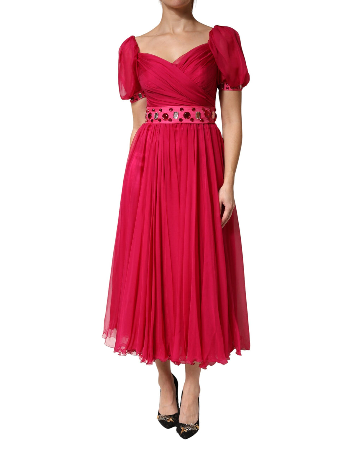 Indulge in the exquisite allure of the Dolce & Gabbana Pink Silk Embellished A-line Midi Dress, a timeless masterpiece of Italian craftsmanship that embodies elegance and sophistication.