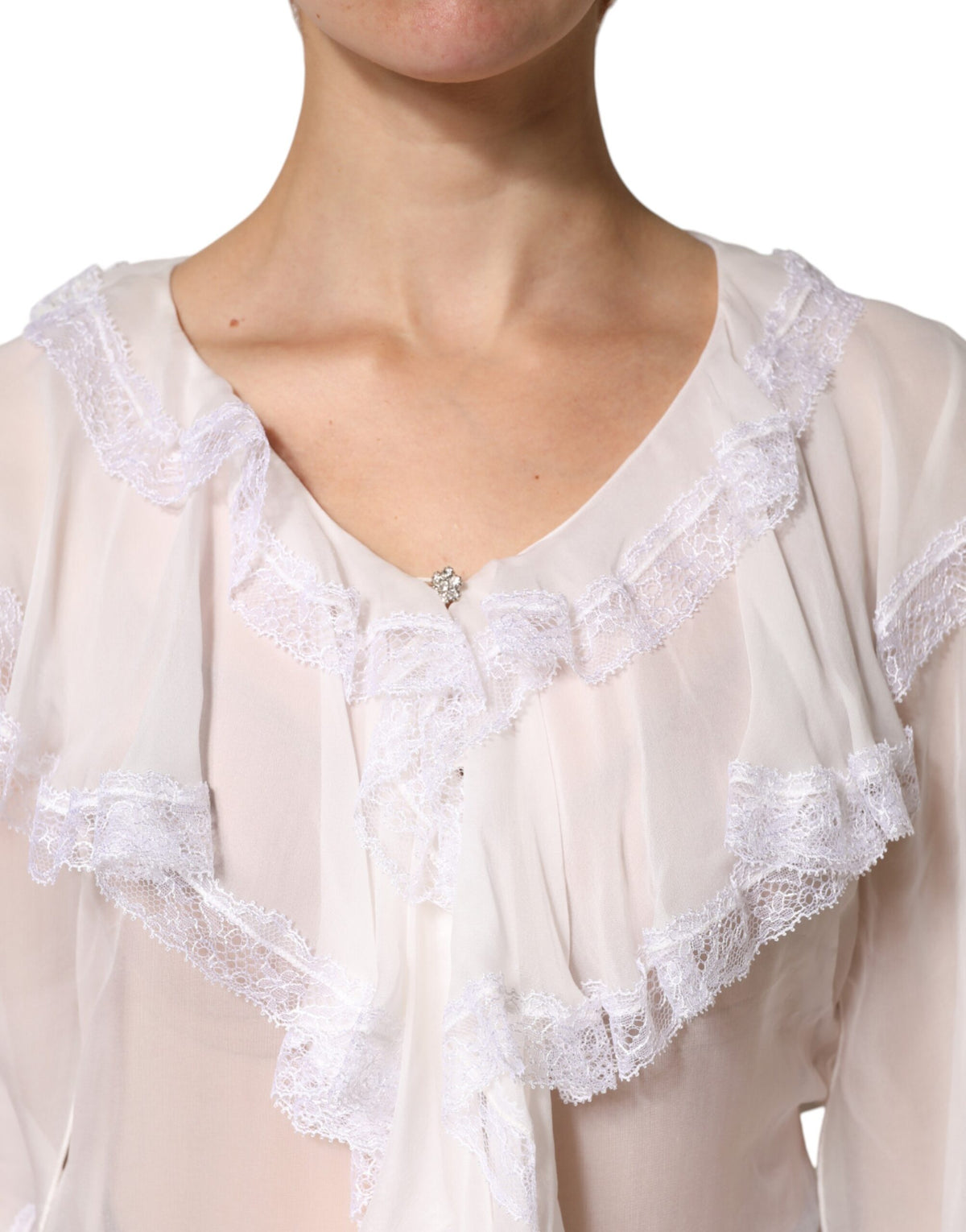 Indulge in the exquisite Dolce & Gabbana White Ruffles Lace Long Sleeve Blouse, crafted from a luxurious silk blend, embodying timeless elegance and sophisticated allure.